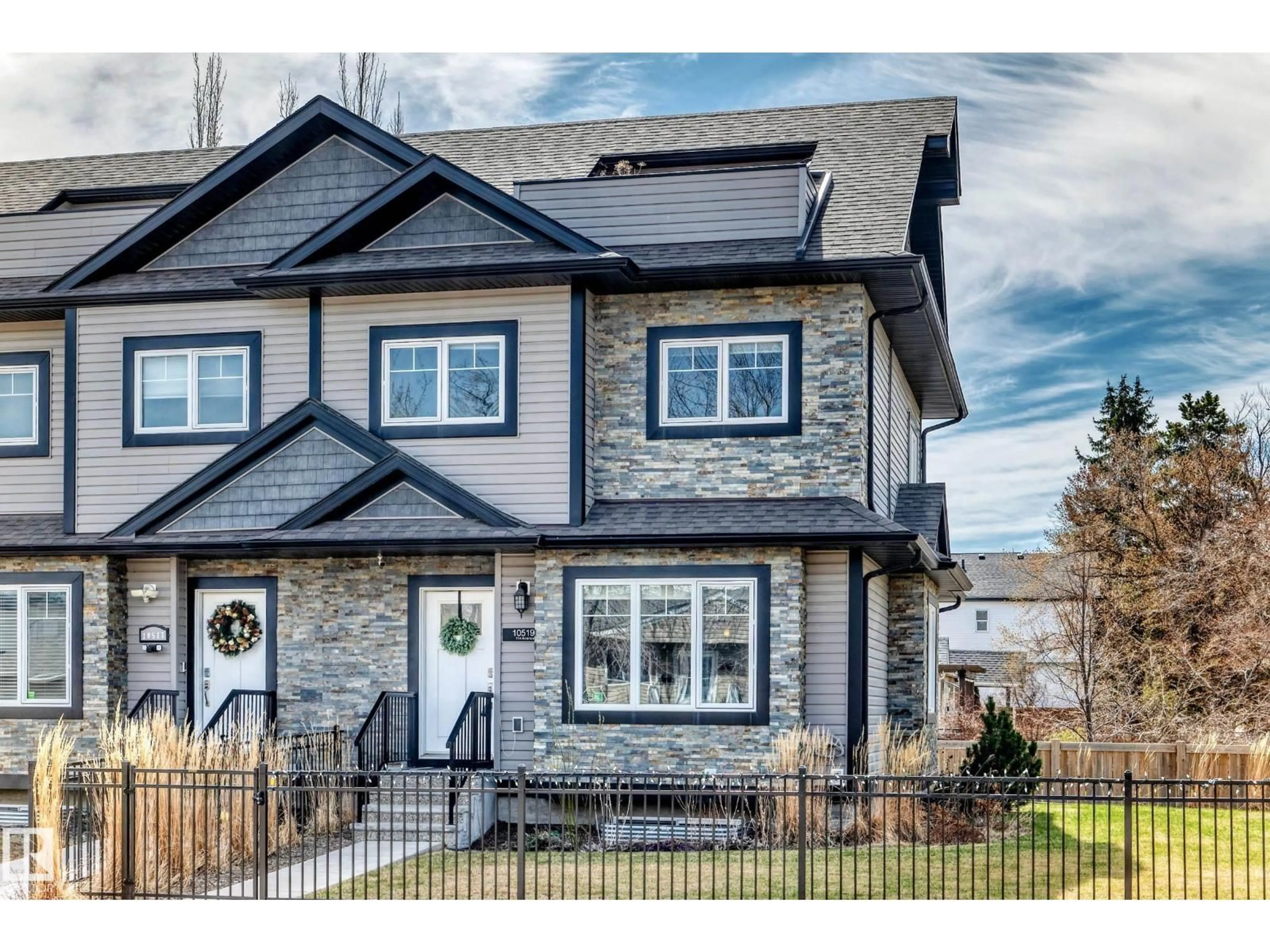 Home with vinyl exterior material, street for 10519 114 AV, Edmonton Alberta T5G1Z4