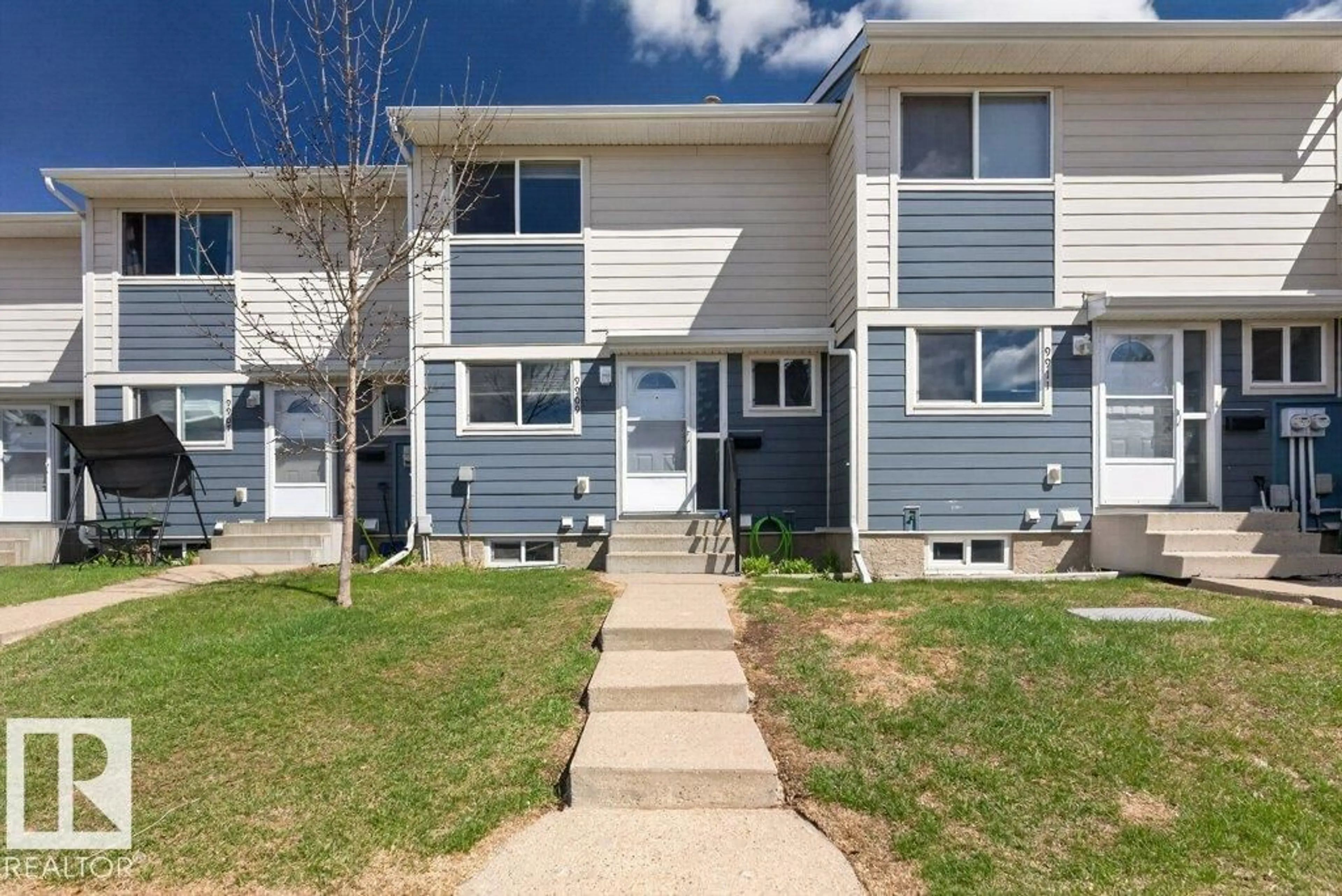Home with vinyl exterior material, street for 9909 171 AV, Edmonton Alberta T5X4X2