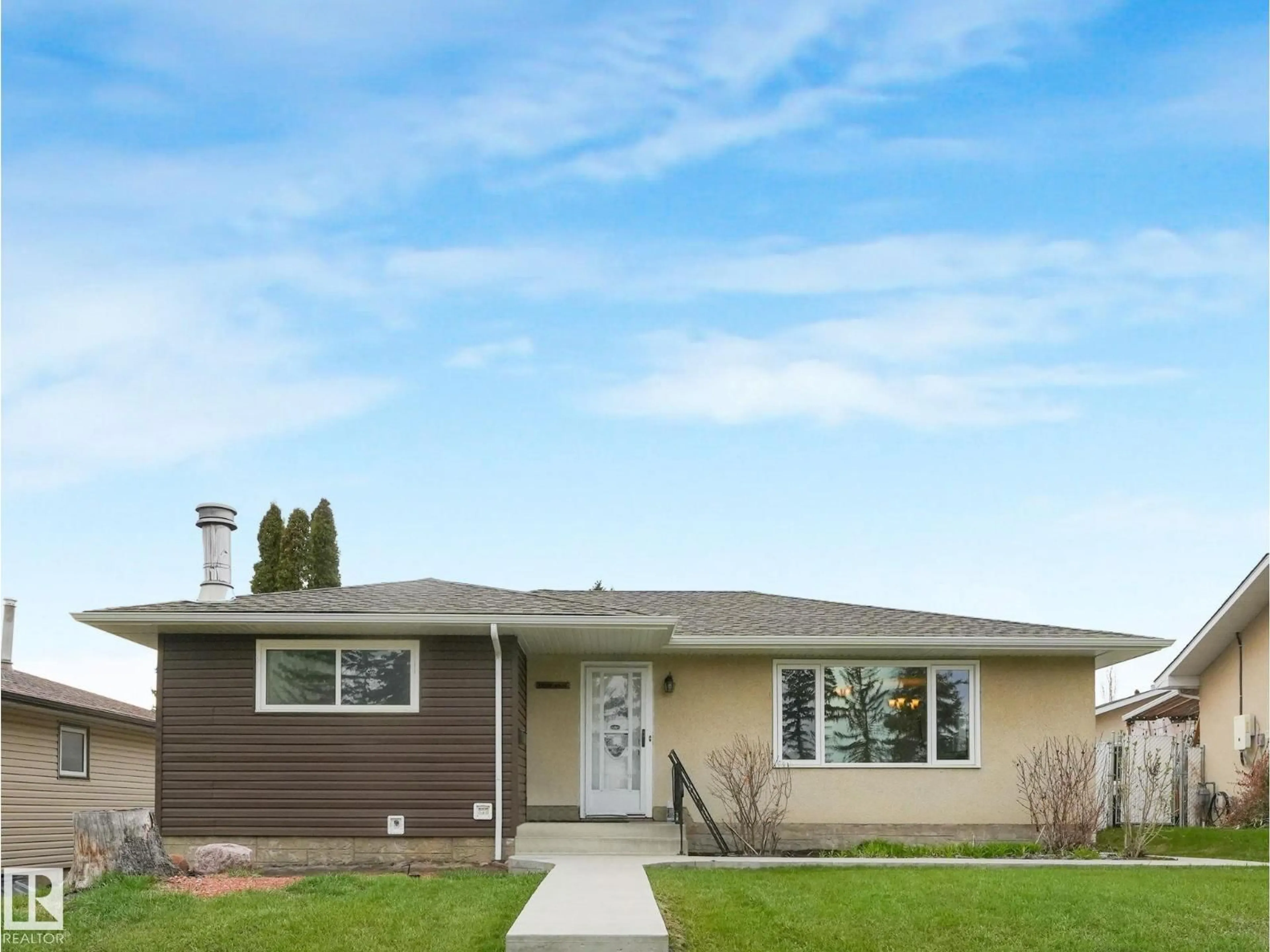 Home with vinyl exterior material, street for NW - 14024 69 ST, Edmonton Alberta T5C0H8