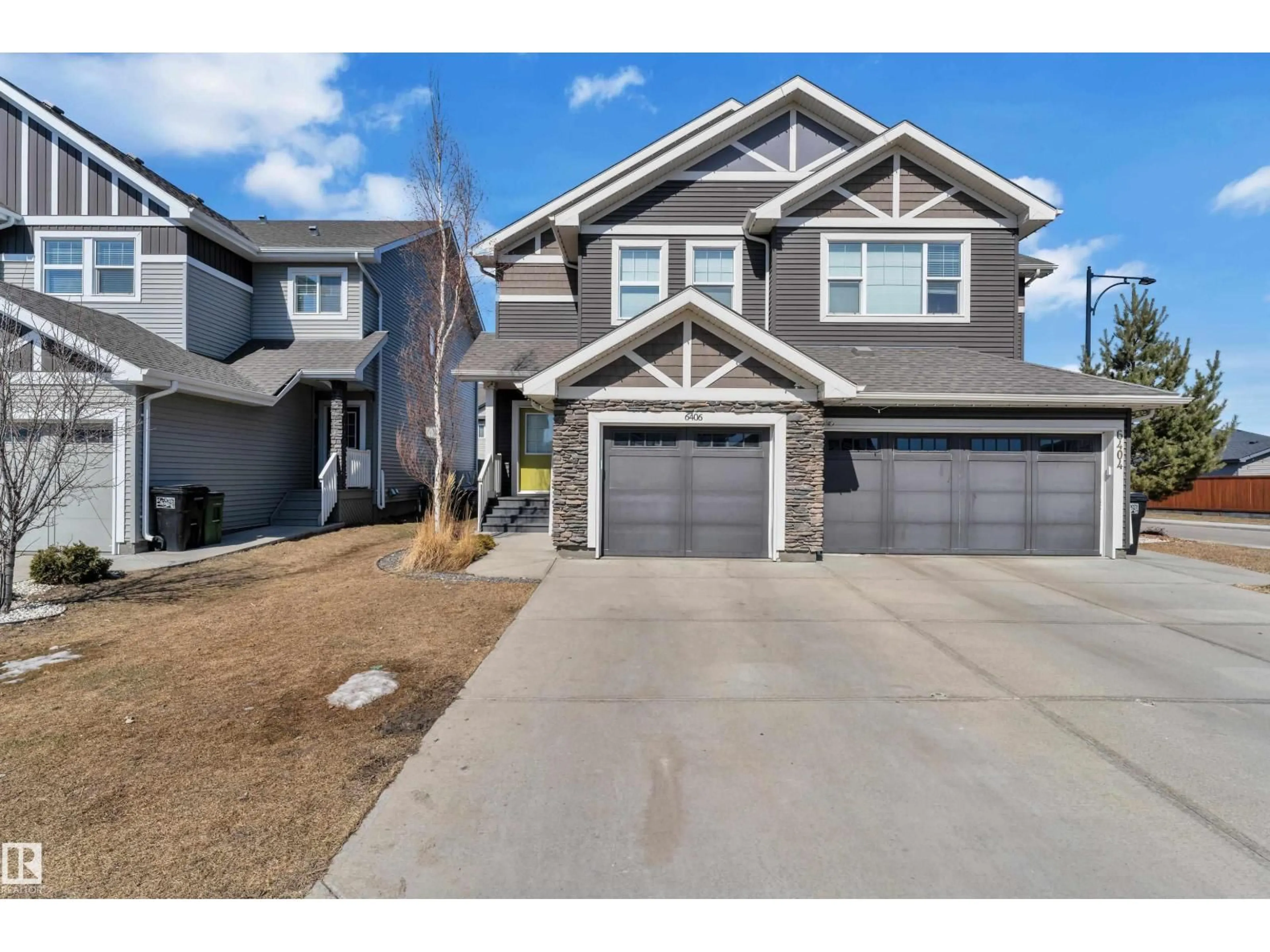 Home with vinyl exterior material, street for 6406 169 AV, Edmonton Alberta T5Y3W6