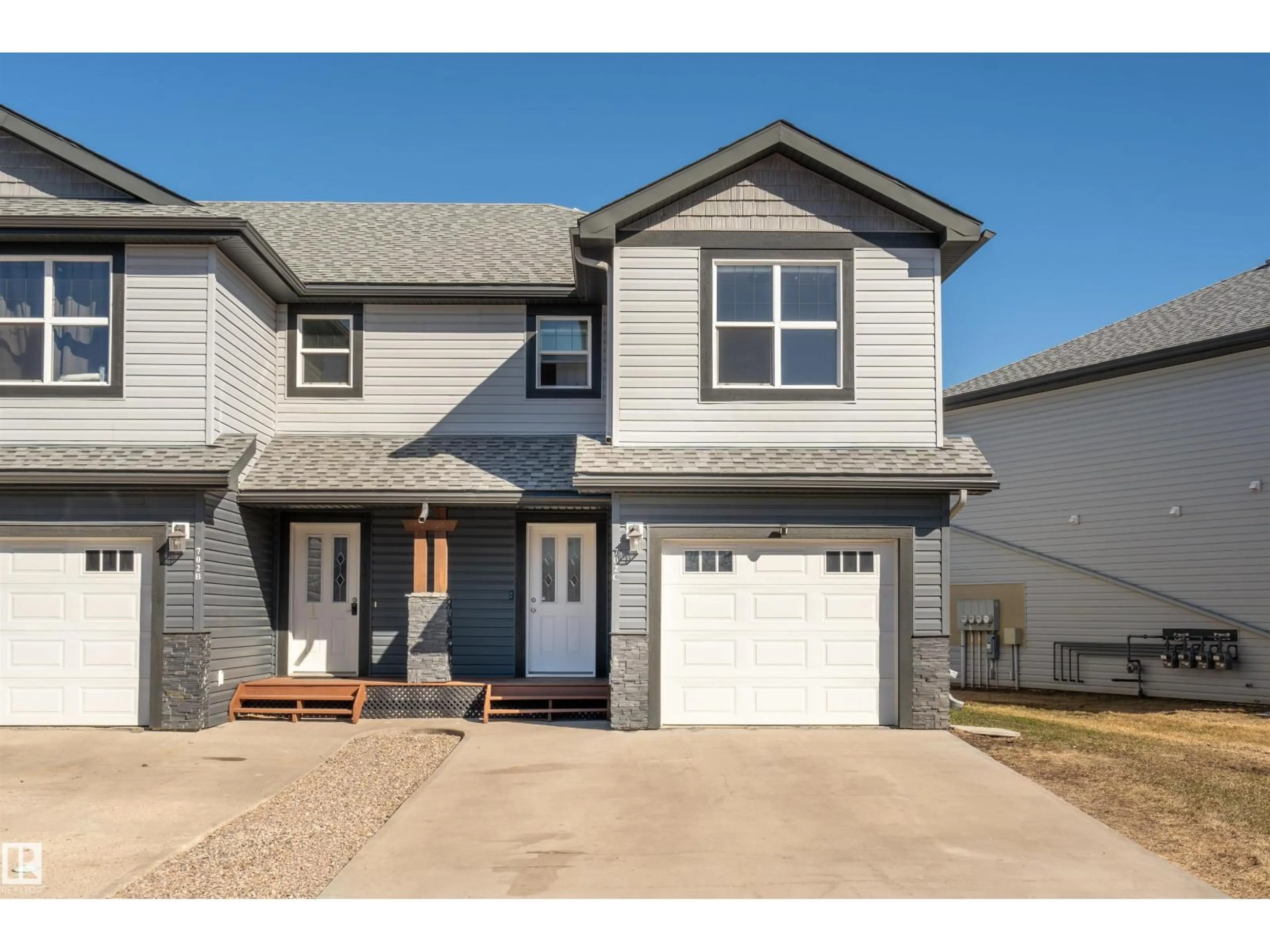 Home with vinyl exterior material, street for 702C ROCKY WY, Cold Lake Alberta T9M0H3