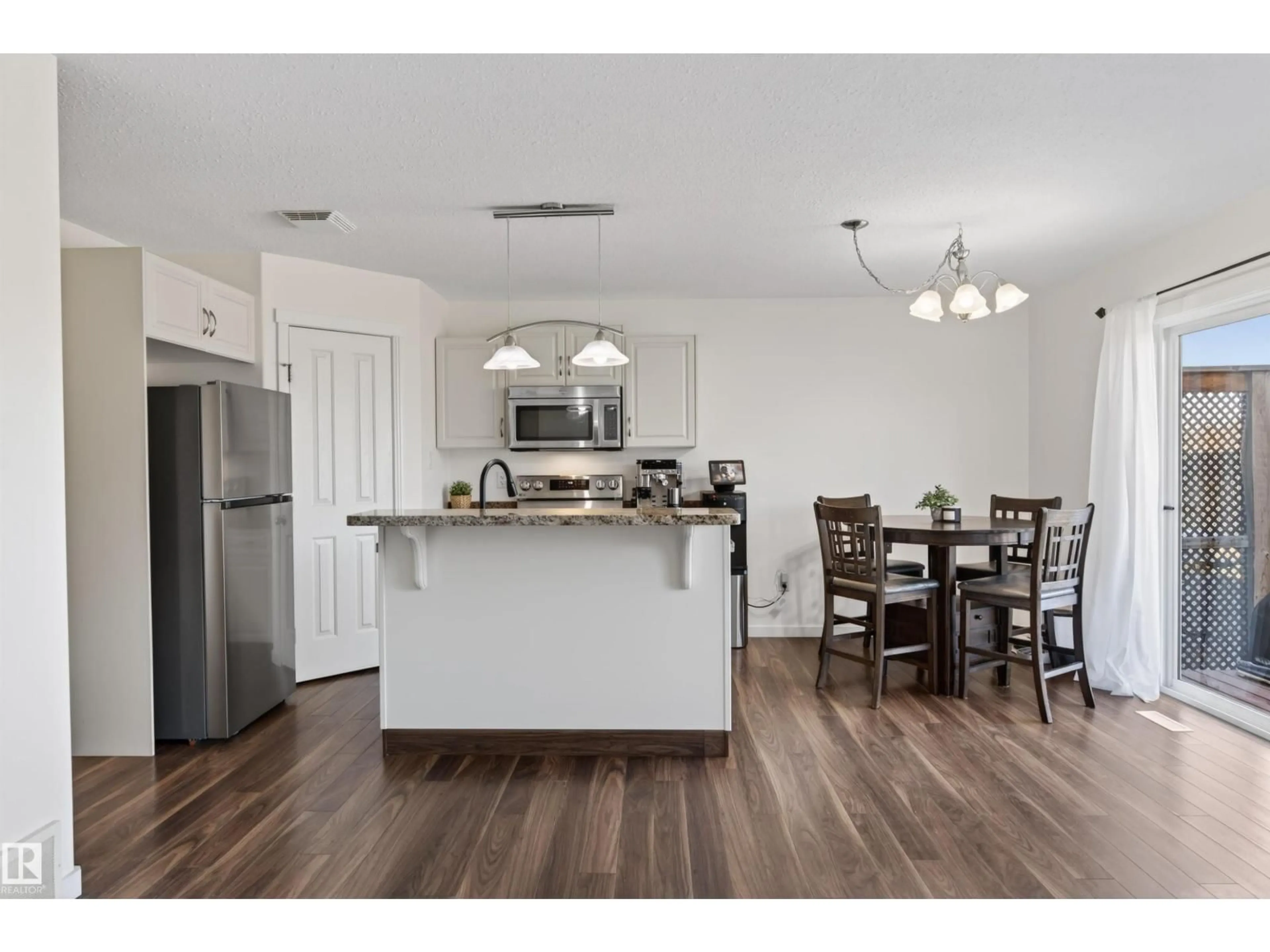 Open concept kitchen, wood/laminate floor for 702C ROCKY WY, Cold Lake Alberta T9M0H3