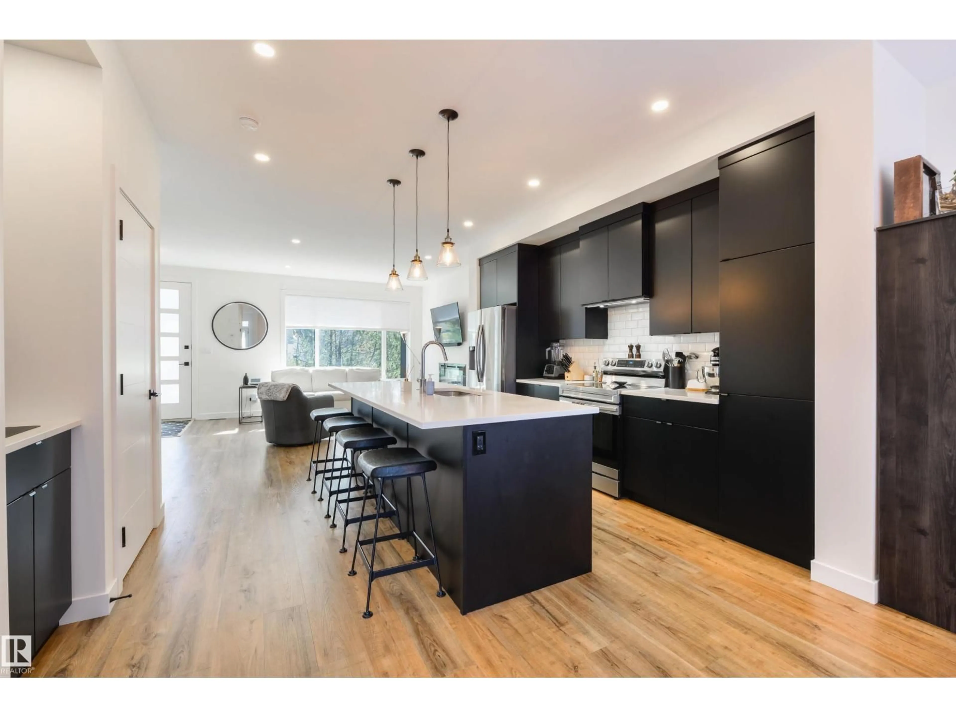 Open concept kitchen, wood/laminate floor for NW - 11414 125 ST, Edmonton Alberta T5M0M9