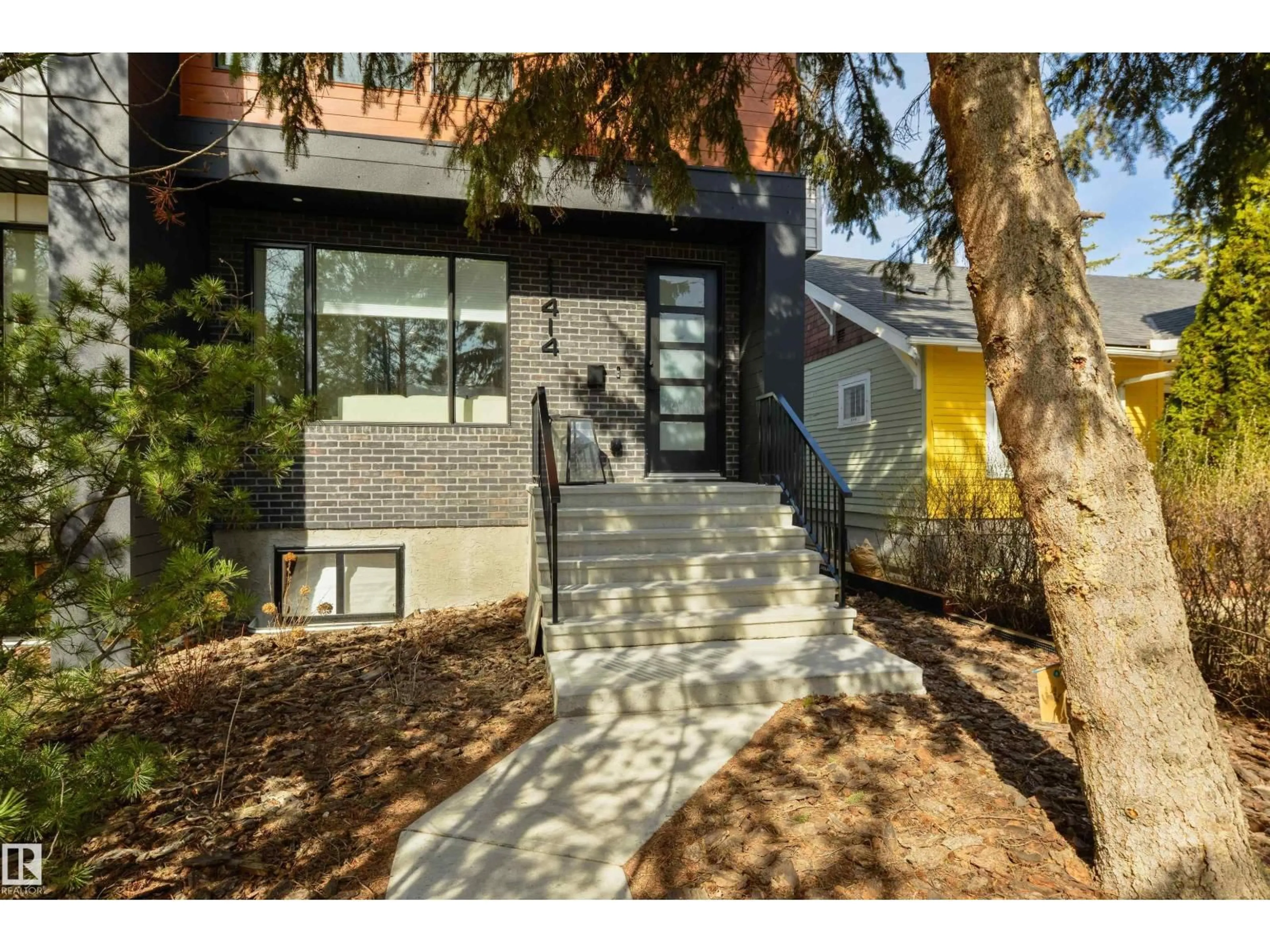 Home with brick exterior material, street for NW - 11414 125 ST, Edmonton Alberta T5M0M9