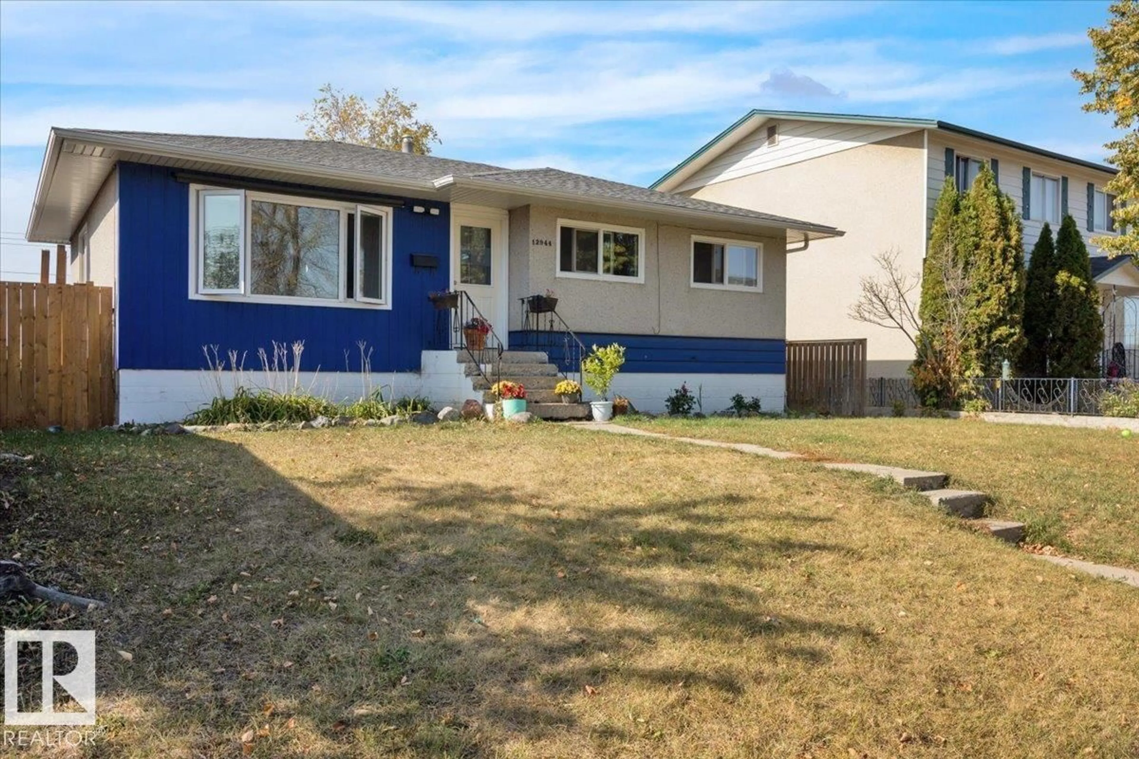Home with vinyl exterior material, street for NW - 12944 128 ST, Edmonton Alberta T5L1E5
