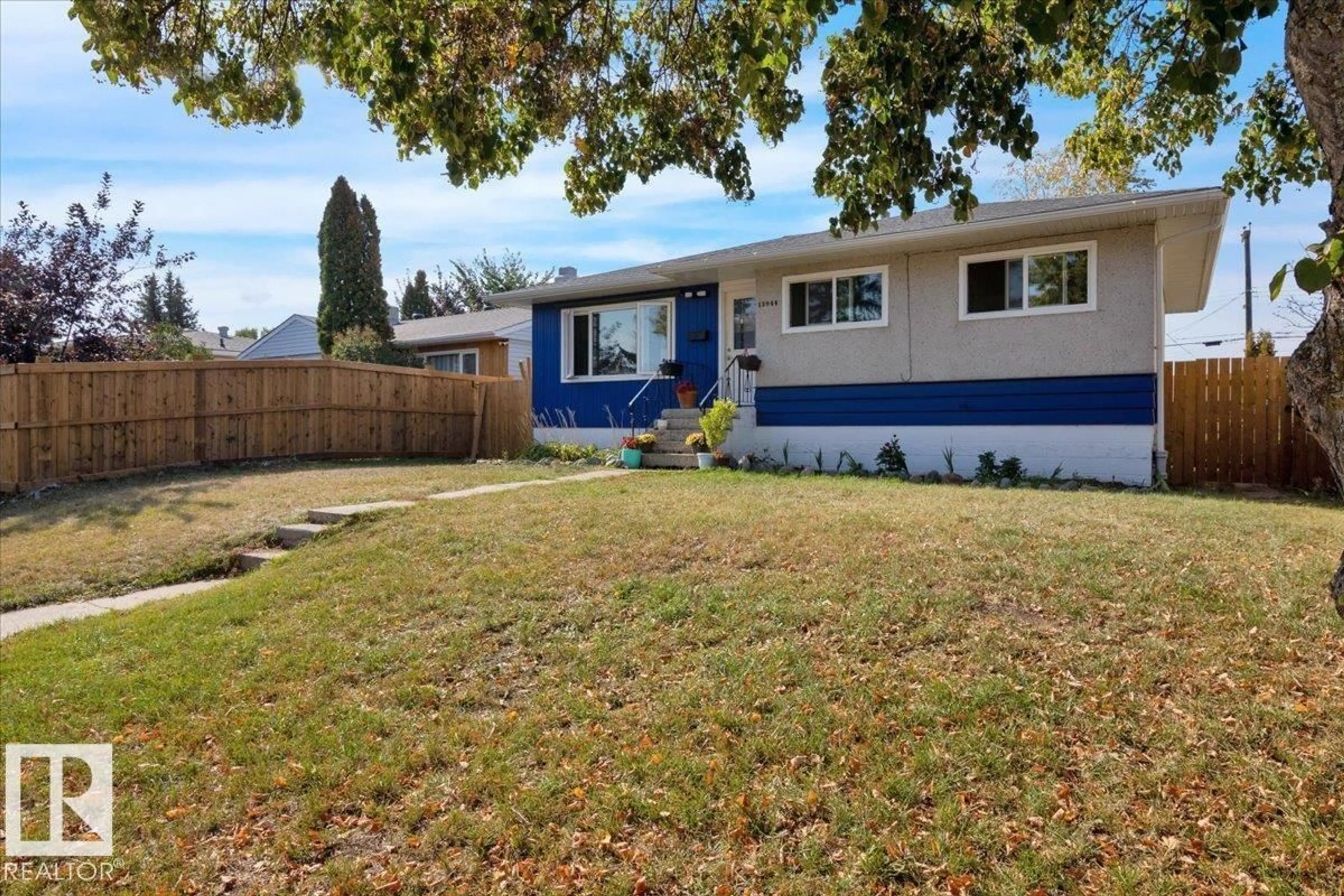 Home with vinyl exterior material, street for NW - 12944 128 ST, Edmonton Alberta T5L1E5