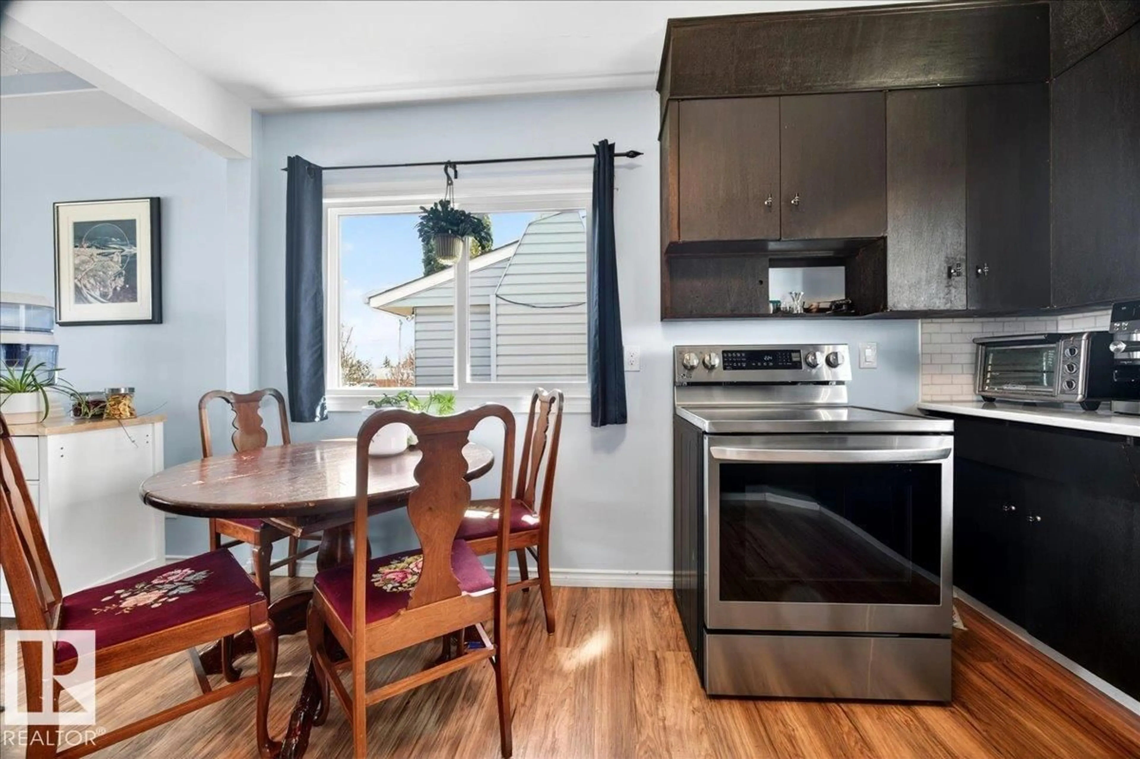 Open concept kitchen, wood/laminate floor for NW - 12944 128 ST, Edmonton Alberta T5L1E5