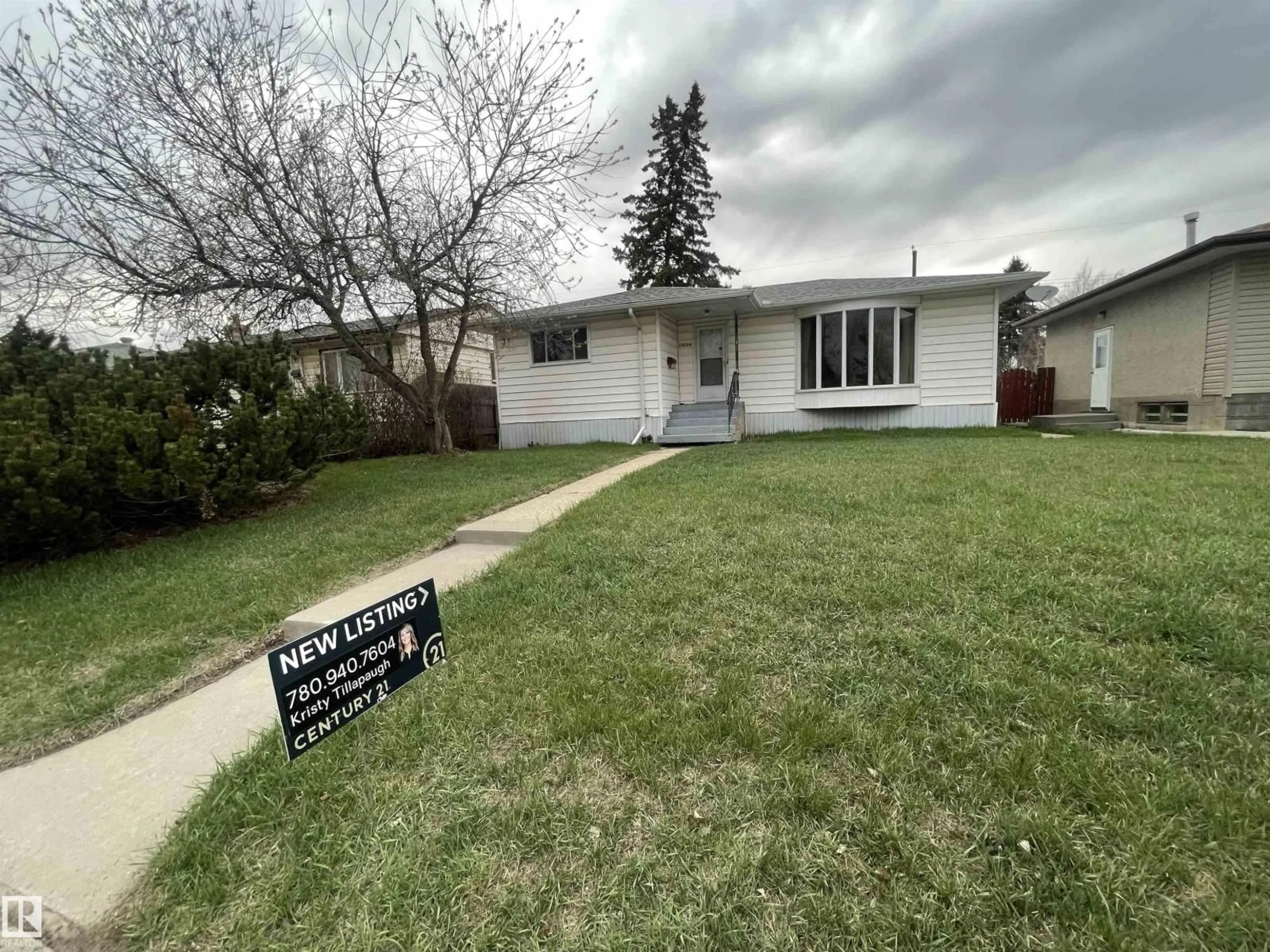 Home with vinyl exterior material, street for 13804 132 AV, Edmonton Alberta T5L3R8