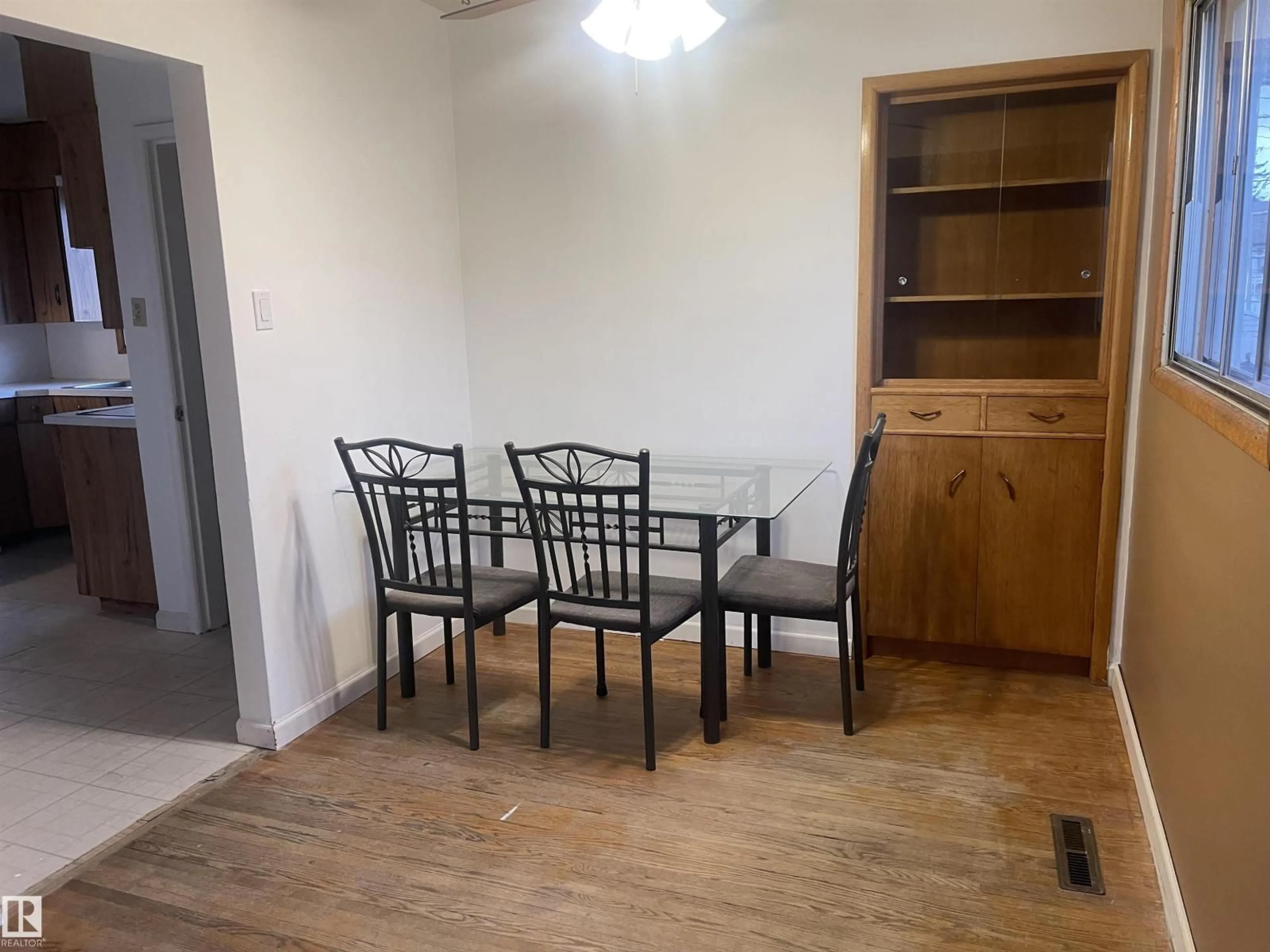 Dining room, wood/laminate floor for 13804 132 AV, Edmonton Alberta T5L3R8