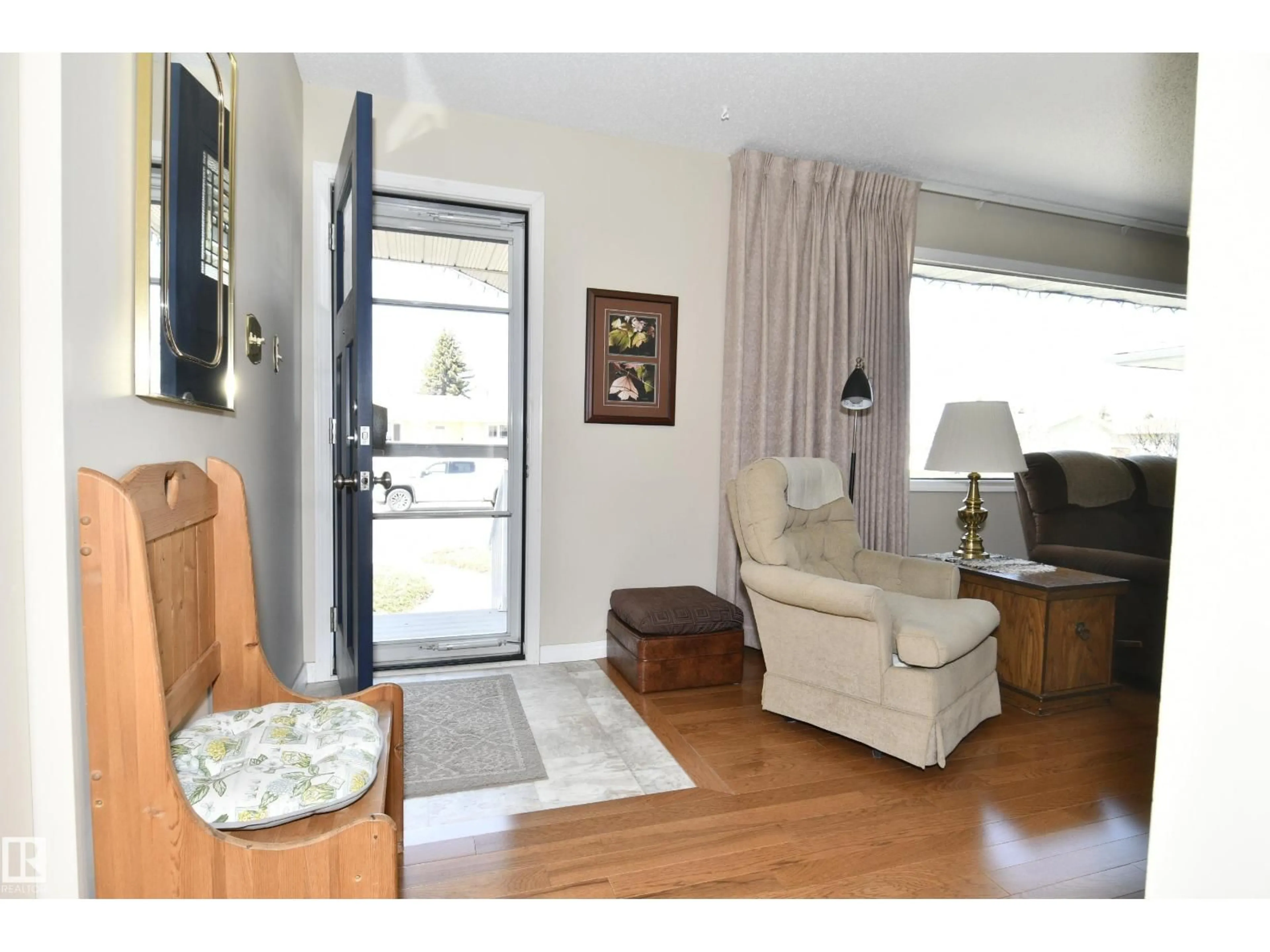 Living room with furniture, wood/laminate floor for 10 ATHAPASKAN DR, Leduc Alberta T9E4N2