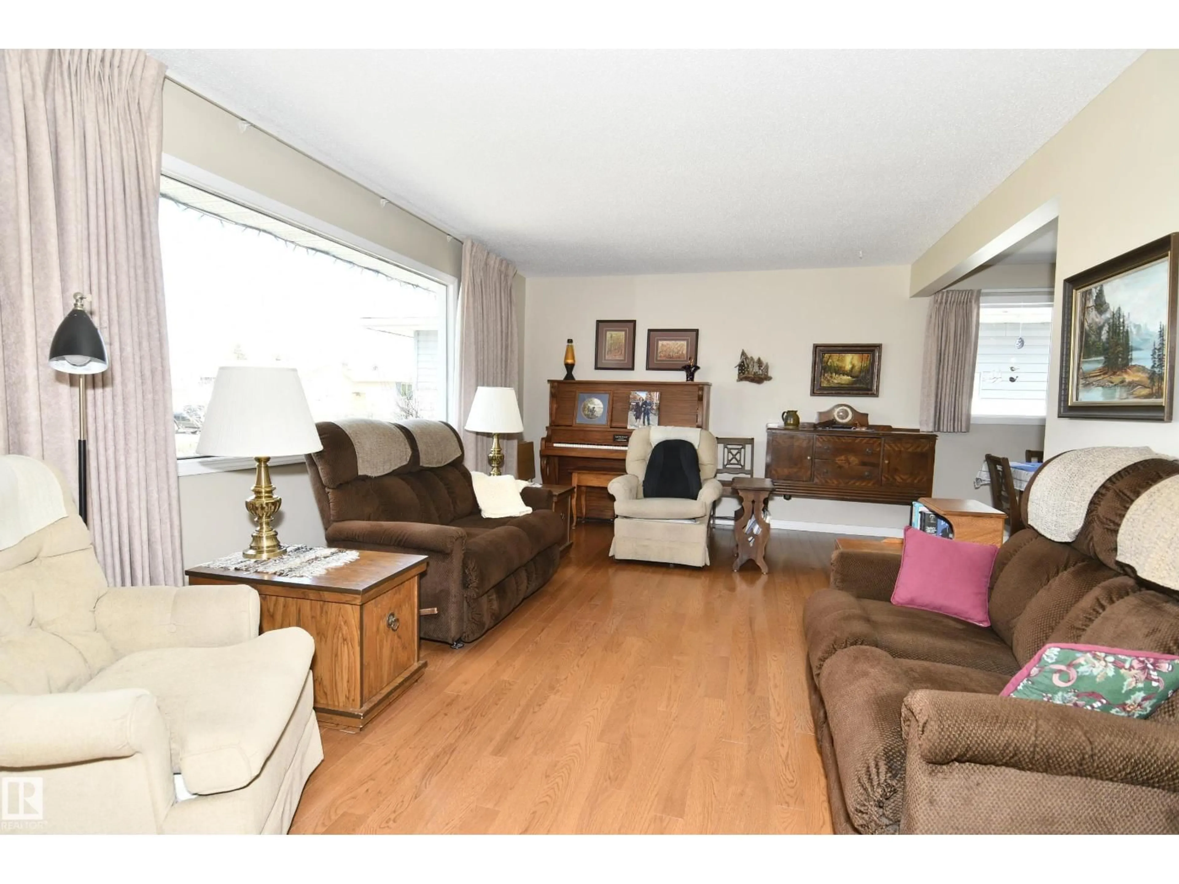 Living room with furniture, wood/laminate floor for 10 ATHAPASKAN DR, Leduc Alberta T9E4N2