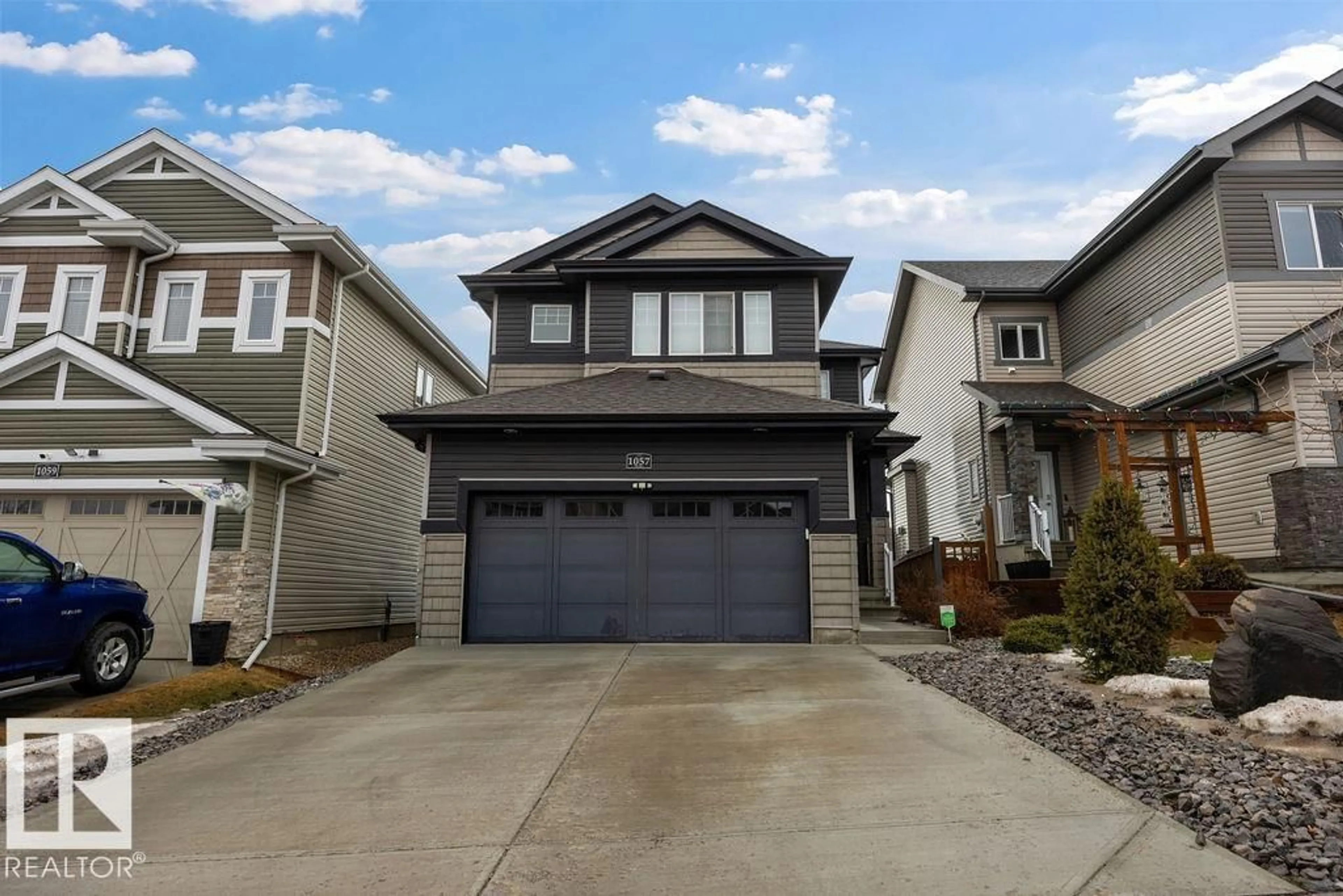 Home with vinyl exterior material, street for 1057 COOPERS HAWK LI, Edmonton Alberta T5S0M2