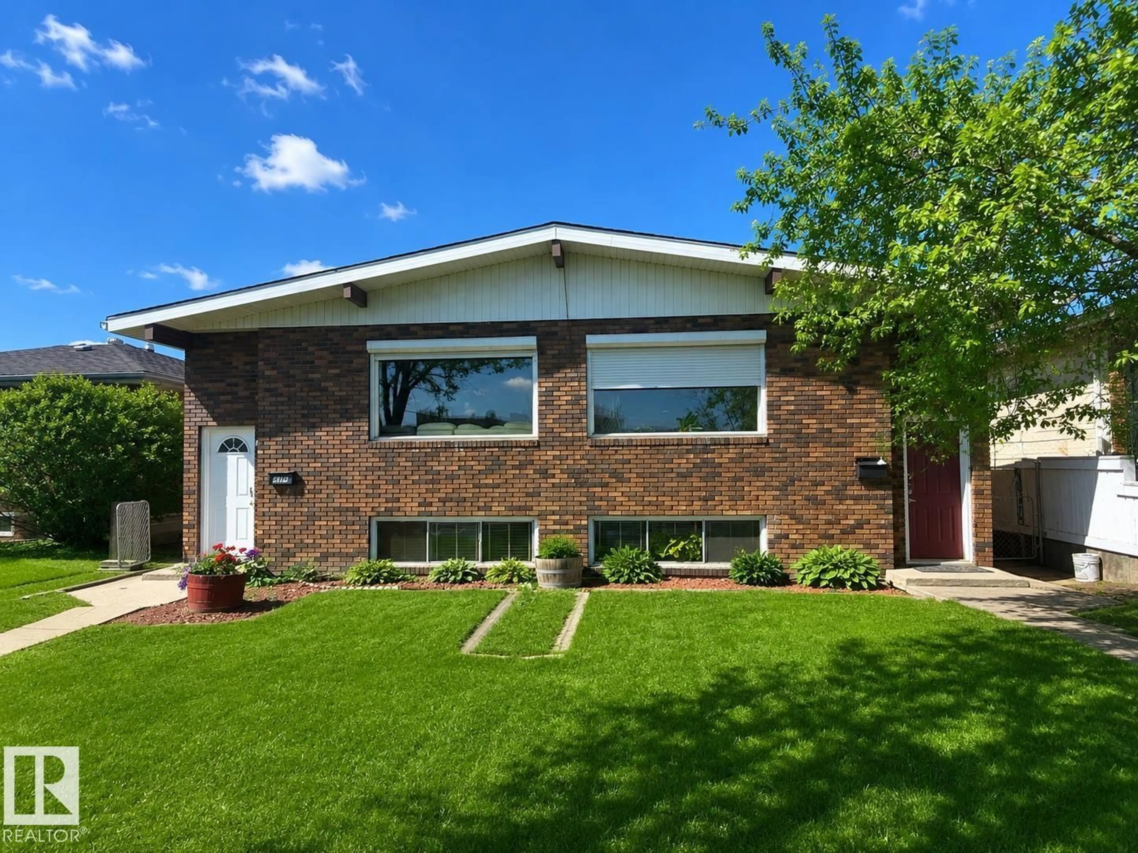 Home with brick exterior material, street for 5712 101 AV, Edmonton Alberta T6A0G8