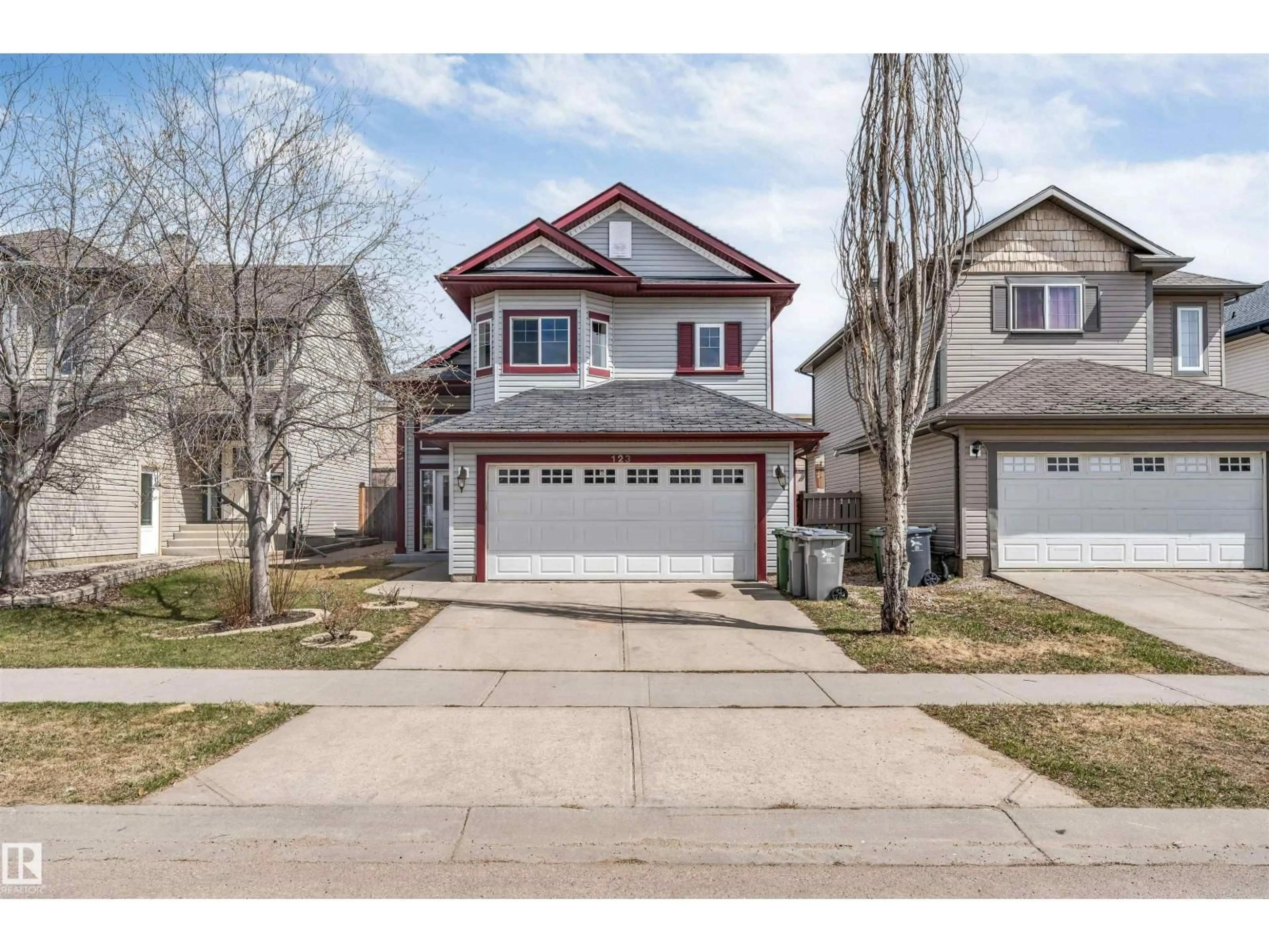 Home with vinyl exterior material, street for 123 RUE MASSON, Beaumont Alberta T4X1S8