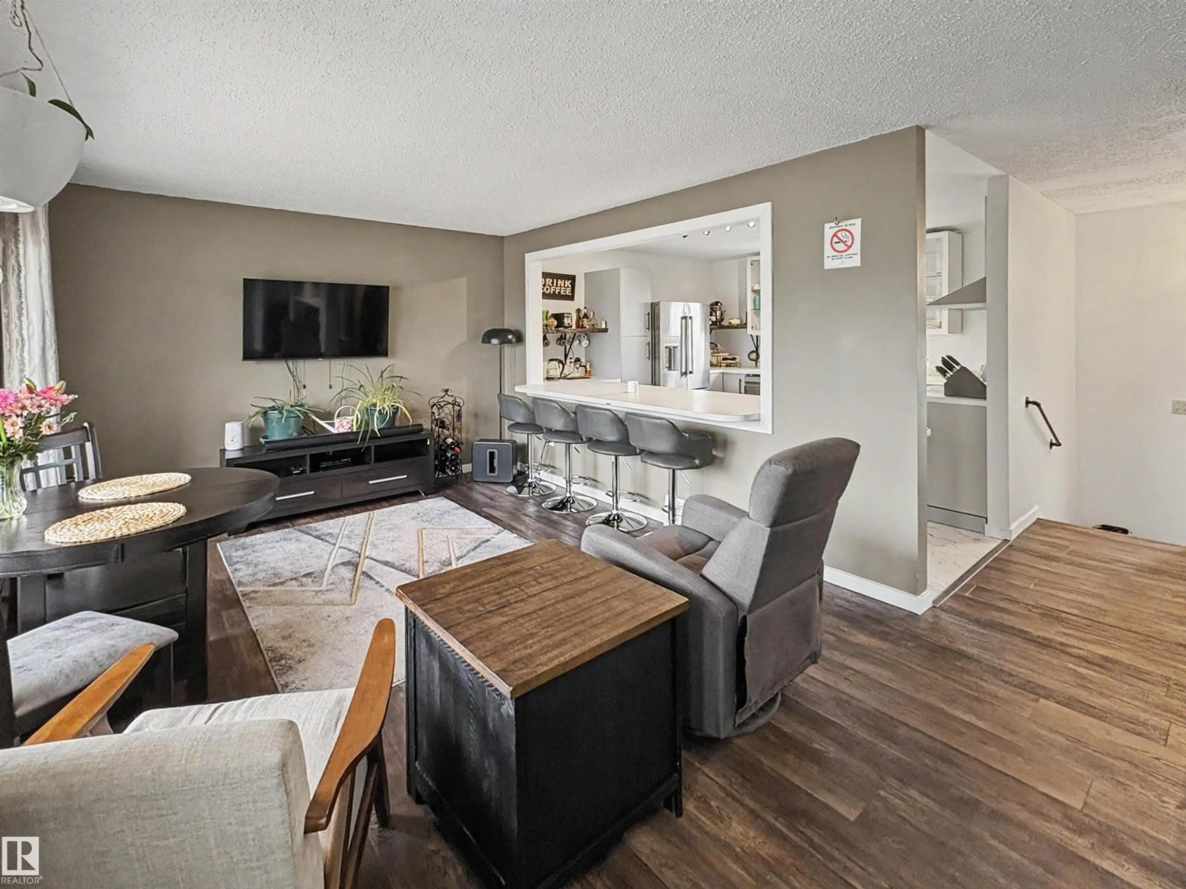 Living room with furniture, wood/laminate floor for 4506 47 AV, Bonnyville Town Alberta T9N1H2