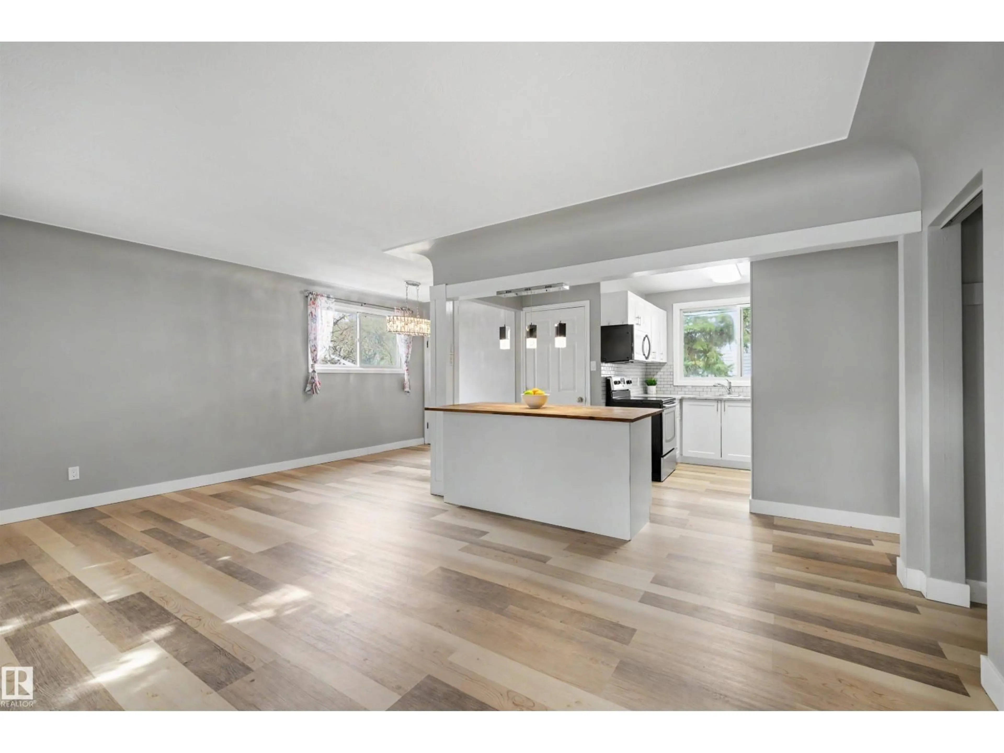 Open concept kitchen, wood/laminate floor for NW - 12423 135 ST, Edmonton Alberta T5L1X8
