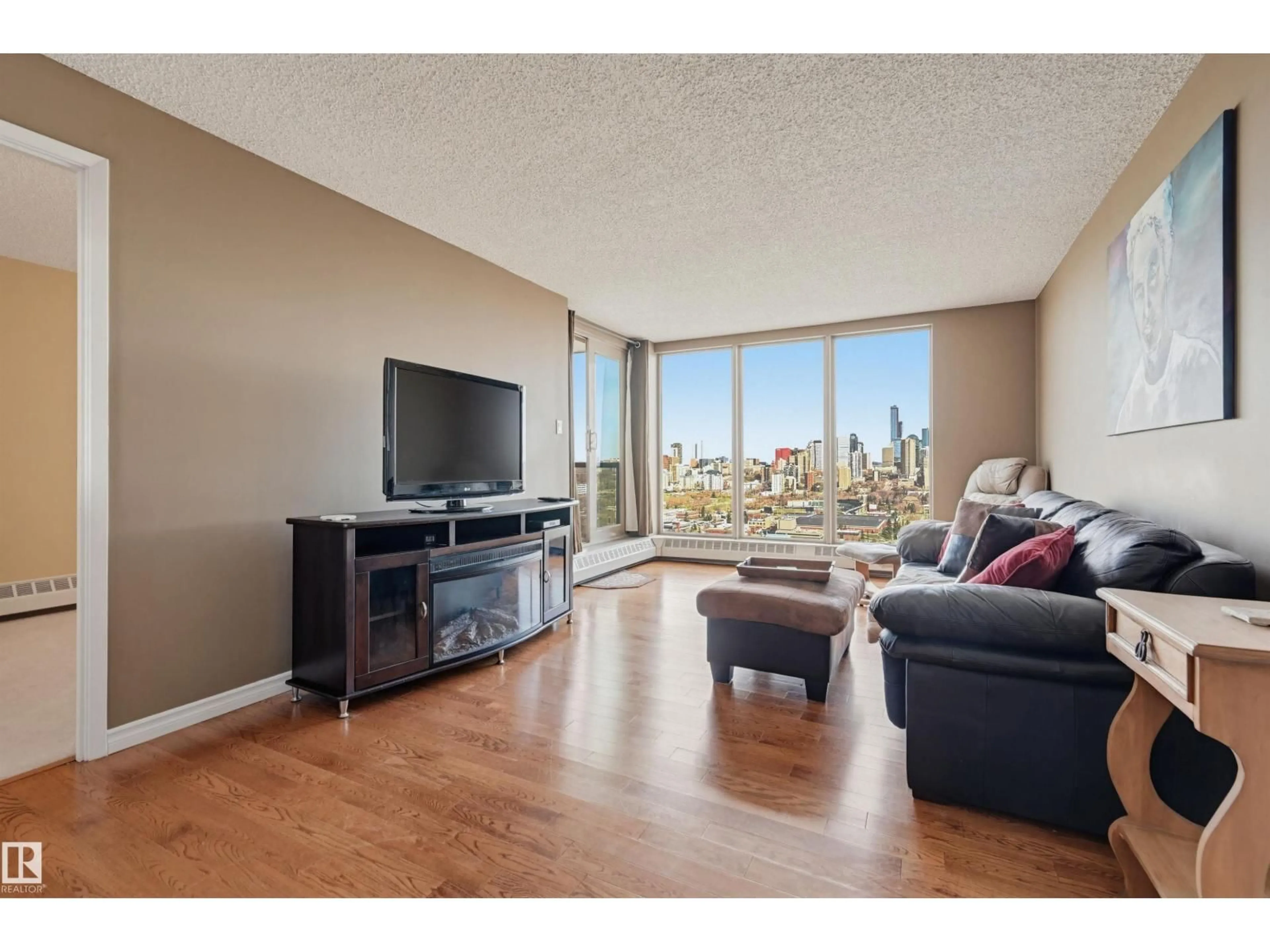 Living room with furniture, wood/laminate floor for #1001 - 1001 SASKATCHEWAN DR, Edmonton Alberta T6E6B6