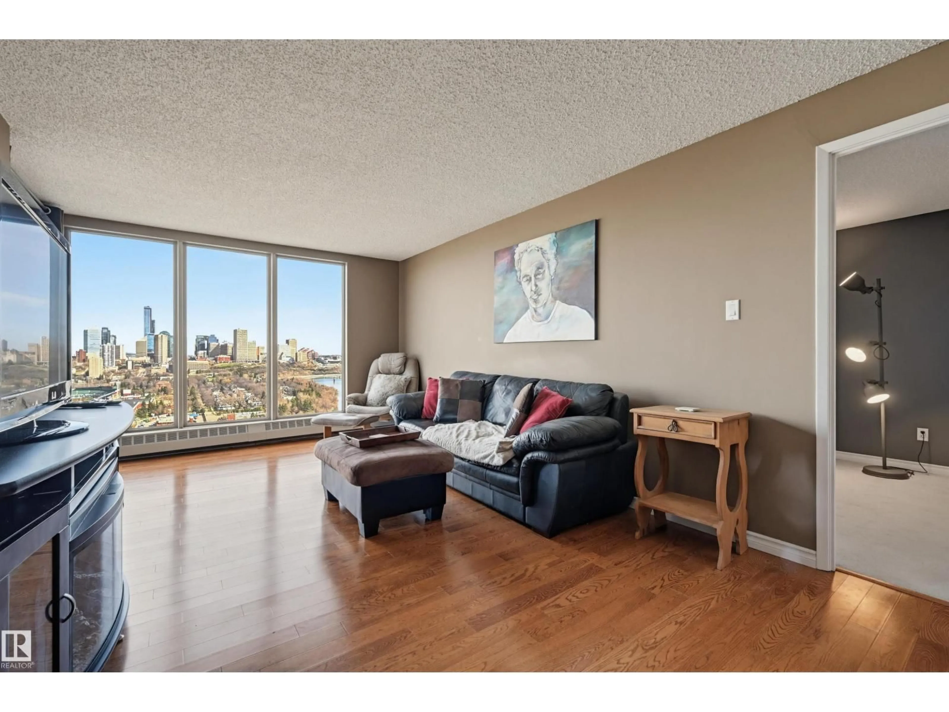 Living room with furniture, wood/laminate floor for #1001 - 1001 SASKATCHEWAN DR, Edmonton Alberta T6E6B6