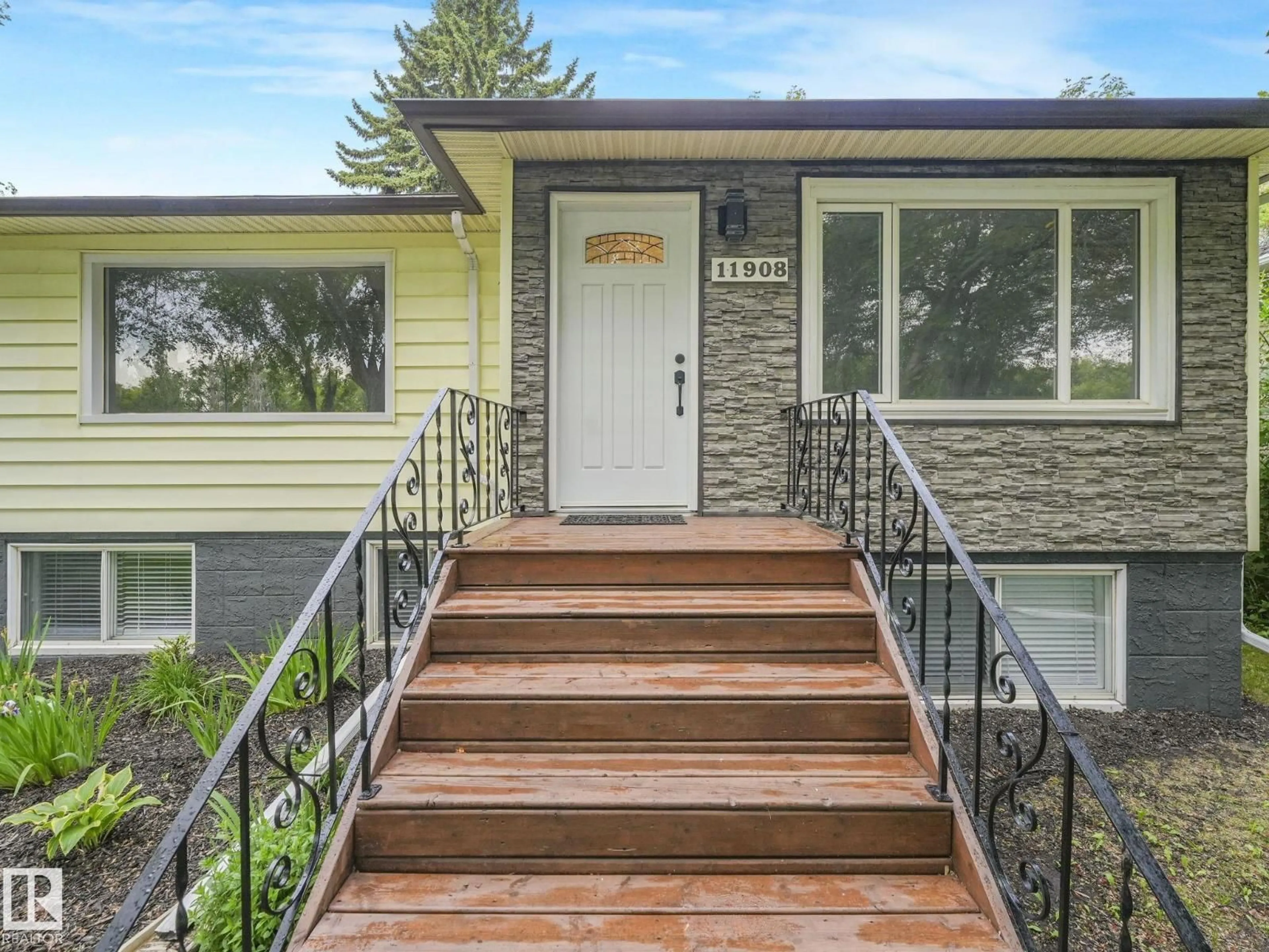 Home with vinyl exterior material, street for NW - 11908 52 ST, Edmonton Alberta T5W3J6