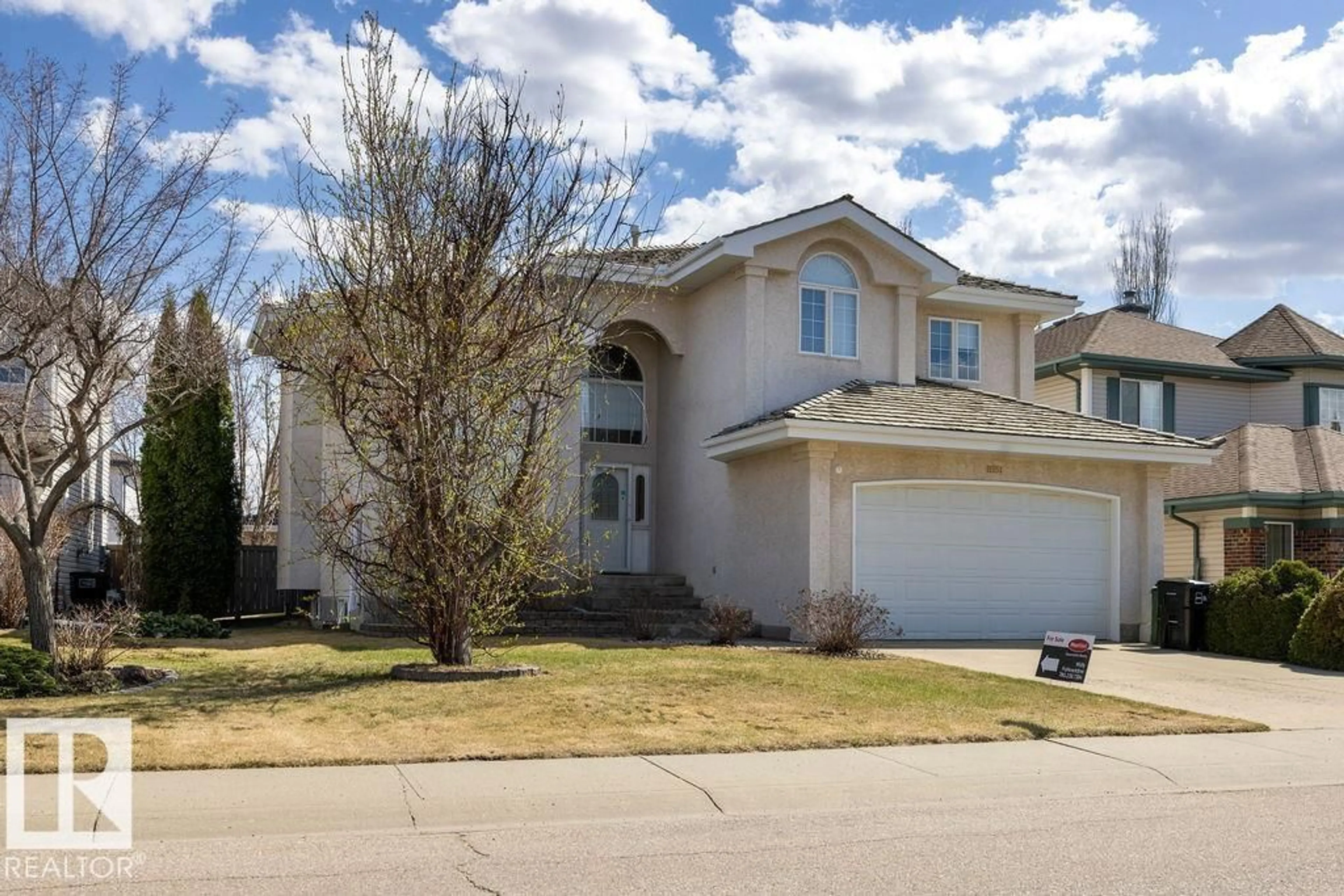 Home with vinyl exterior material, street for 11551 14 AV, Edmonton Alberta T6J7B3