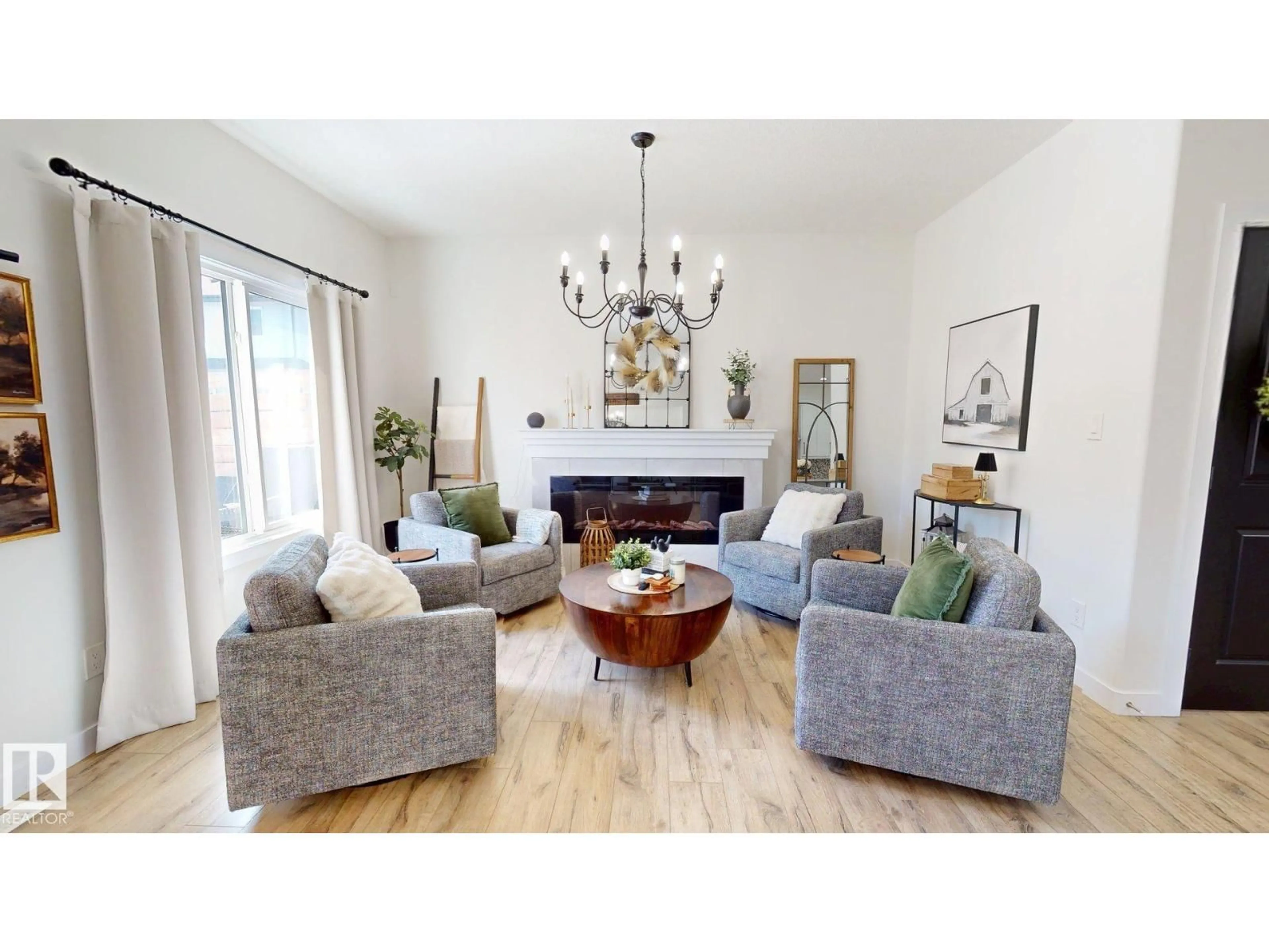 Living room with furniture, wood/laminate floor for 7217 CHIVERS PL, Edmonton Alberta T6W4L4