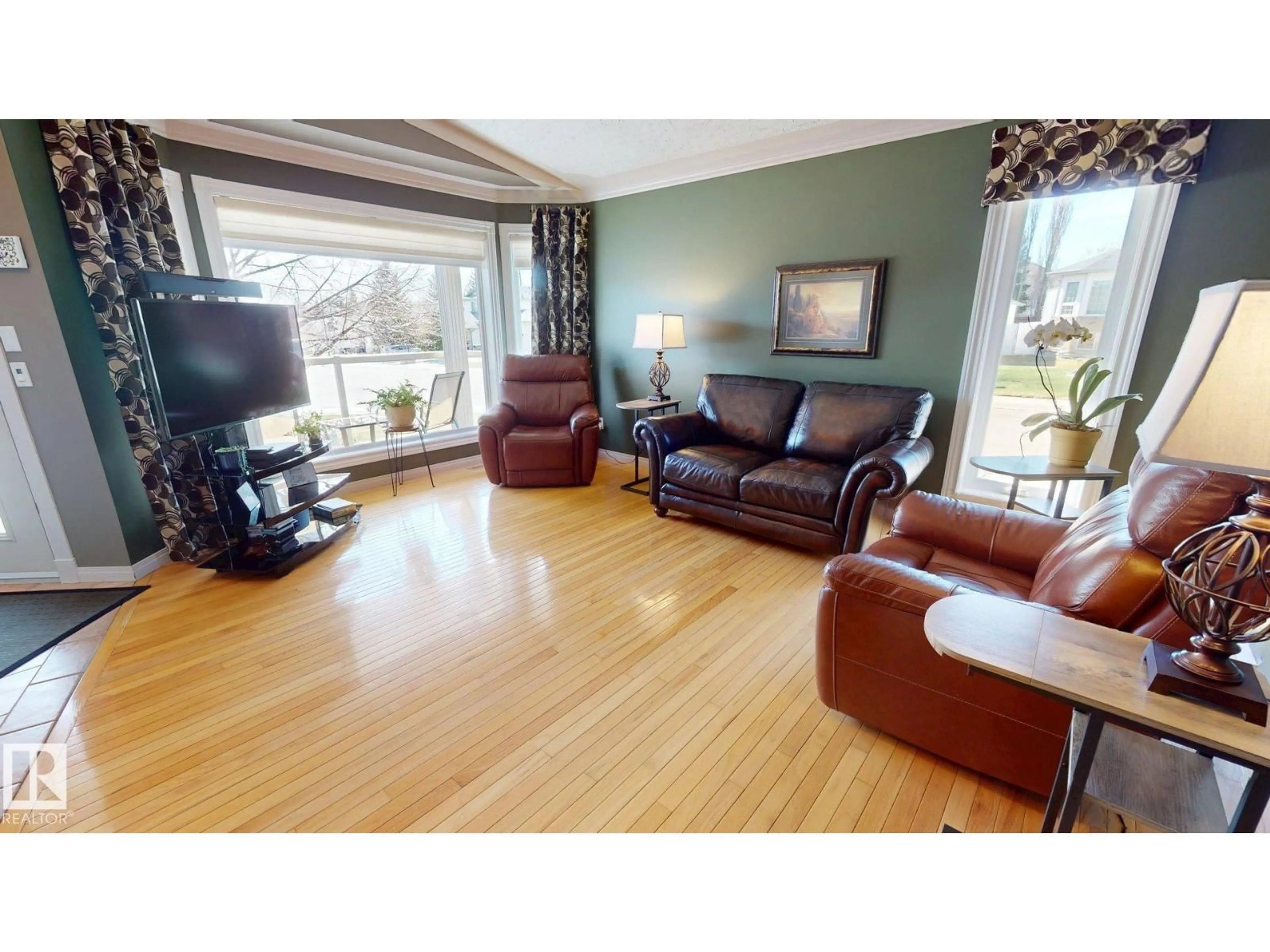 Living room with furniture, wood/laminate floor for 76 CHANCERY WY, Sherwood Park Alberta T8H1Z3