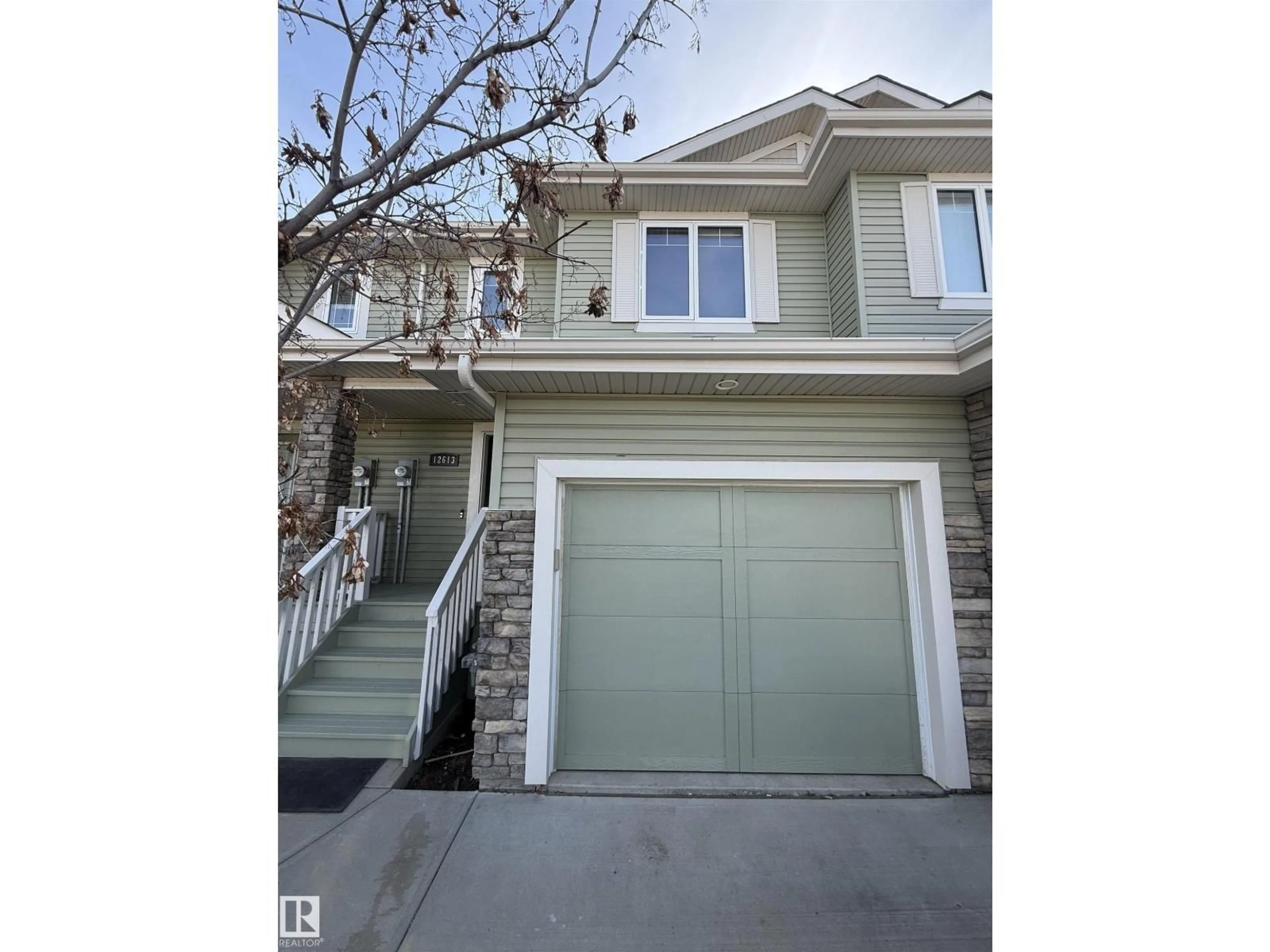 Home with vinyl exterior material, street for NW - 12613 45 ST, Edmonton Alberta T5A1L3