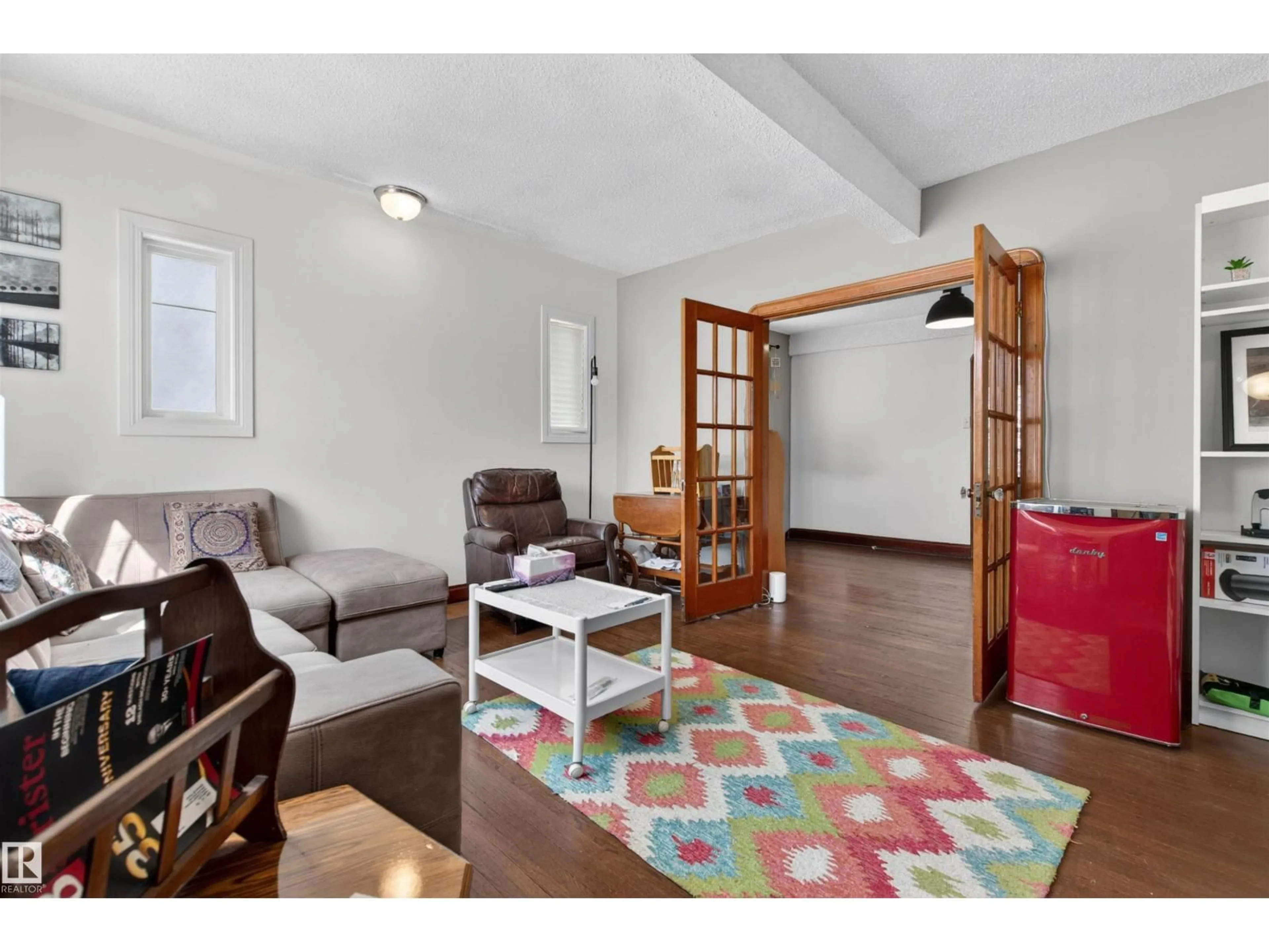Living room with furniture, unknown for 10522 79 AV, Edmonton Alberta T6E1R8