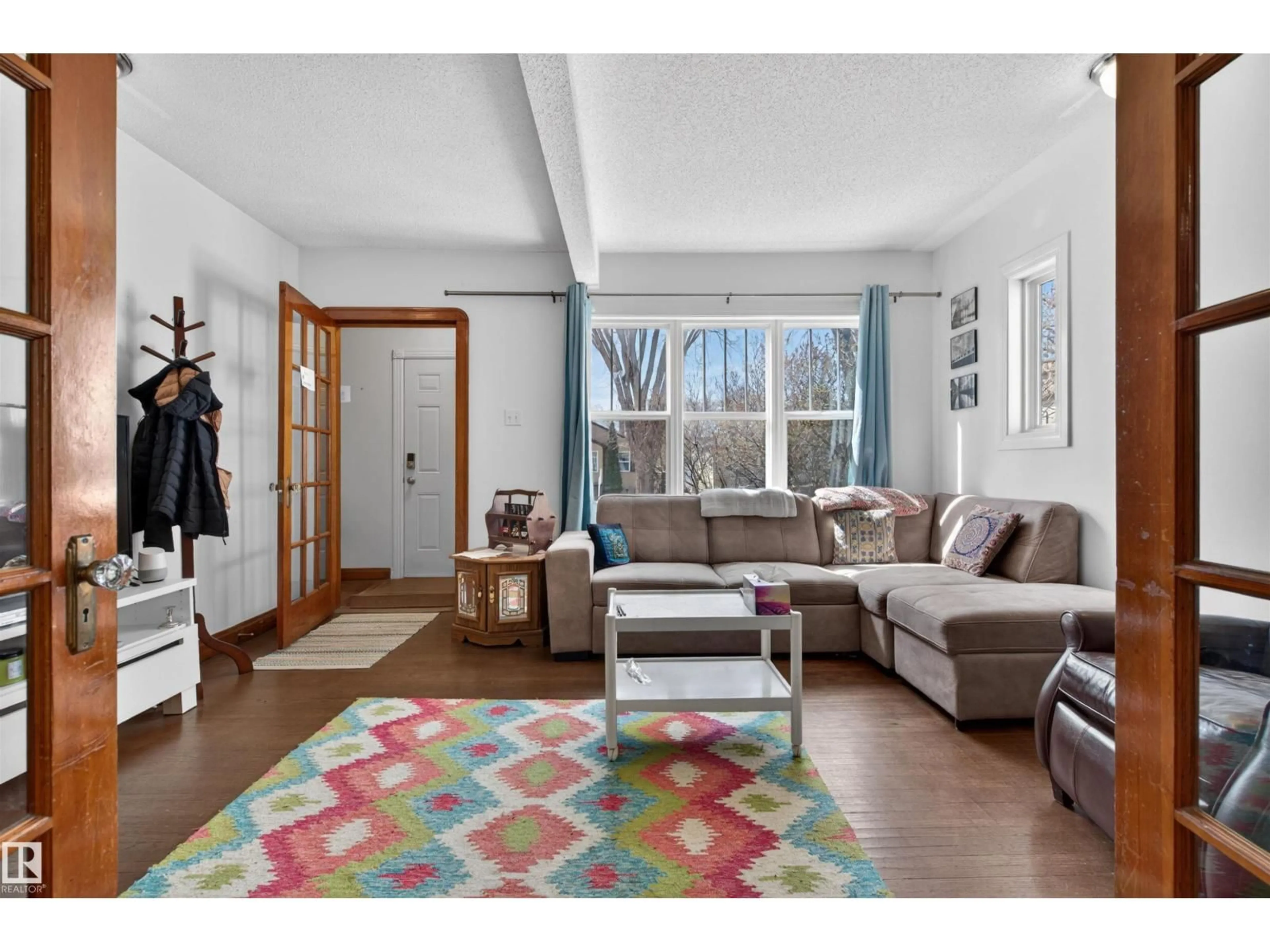 Living room with furniture, unknown for 10522 79 AV, Edmonton Alberta T6E1R8