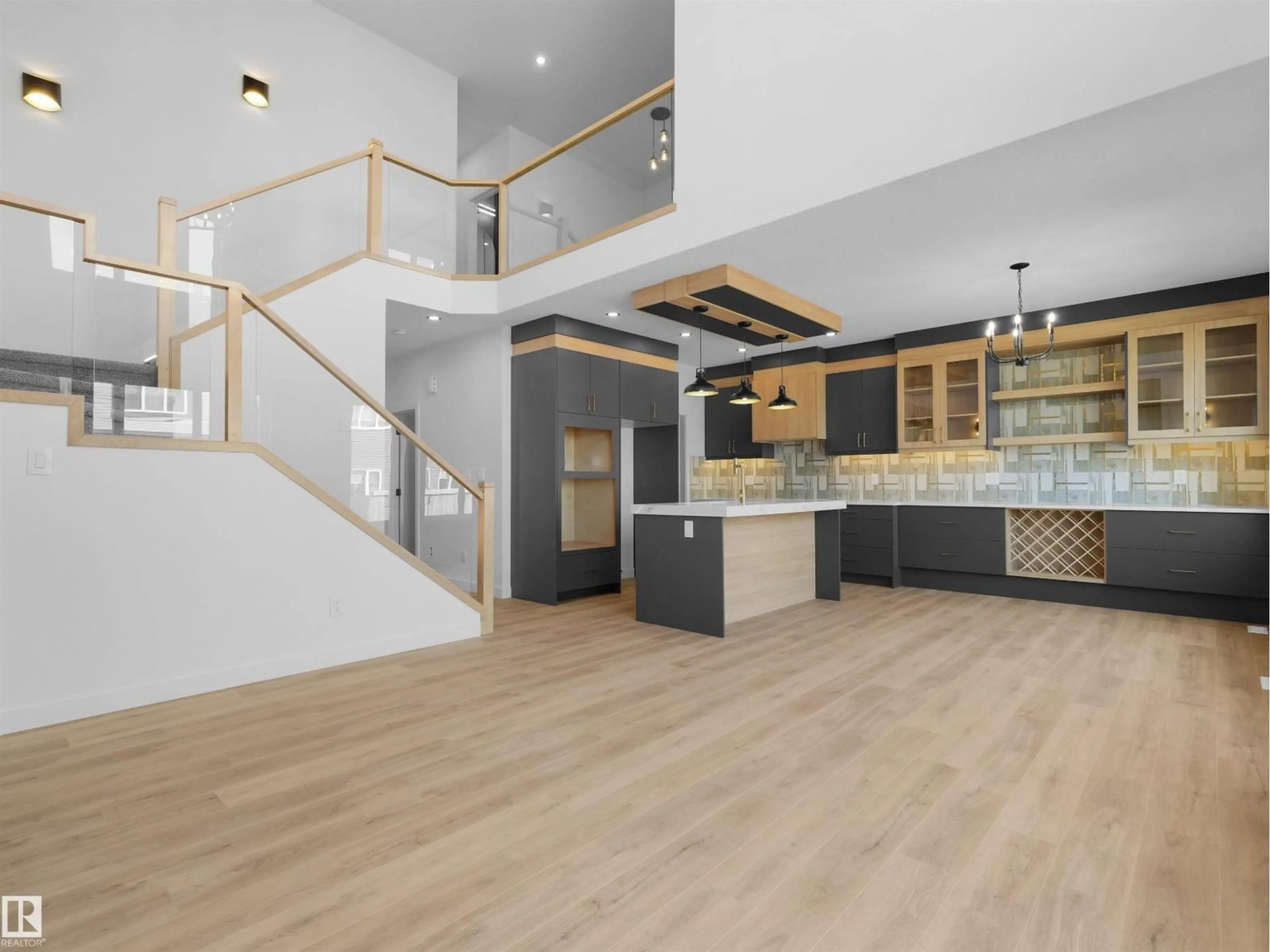 Open concept kitchen, wood/laminate floor for 3520 45 AV, Beaumont Alberta T4X3G9