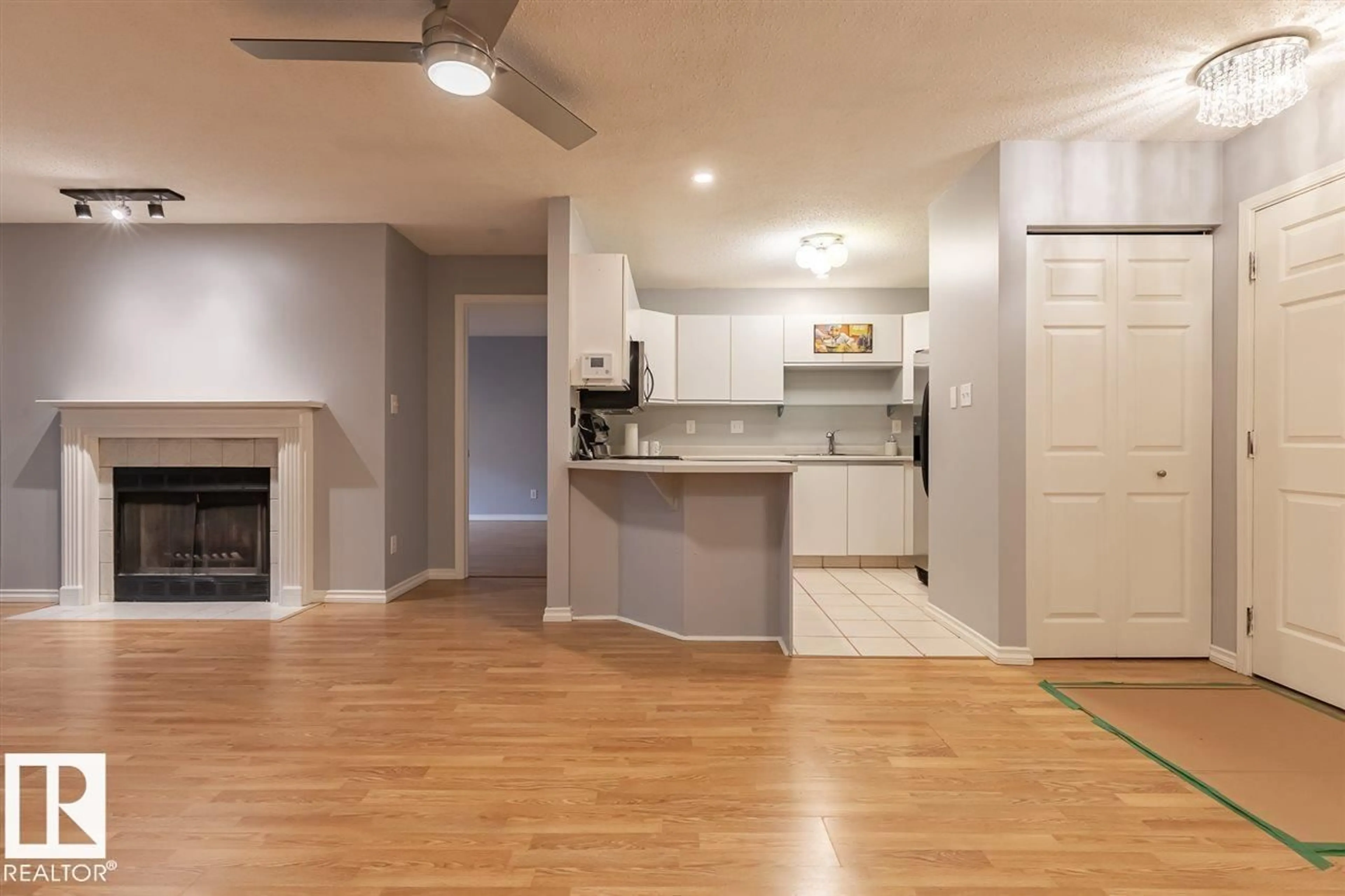 Open concept kitchen, wood/laminate floor for #108 - 9010 106 AV, Edmonton Alberta T5H2K3