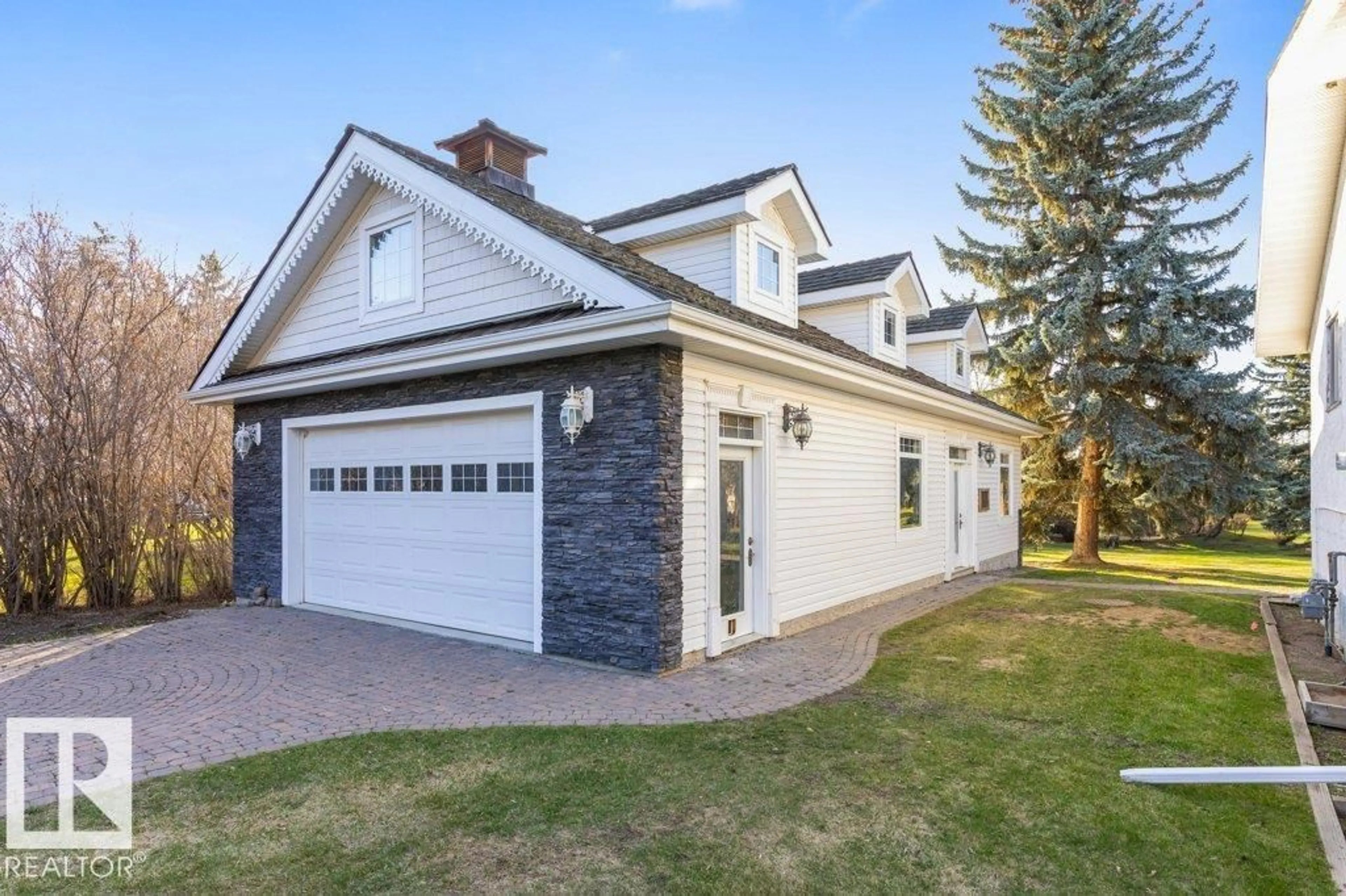 Home with vinyl exterior material, street for 24 25019 STURGEON RD, Rural Sturgeon County Alberta T8N0E1