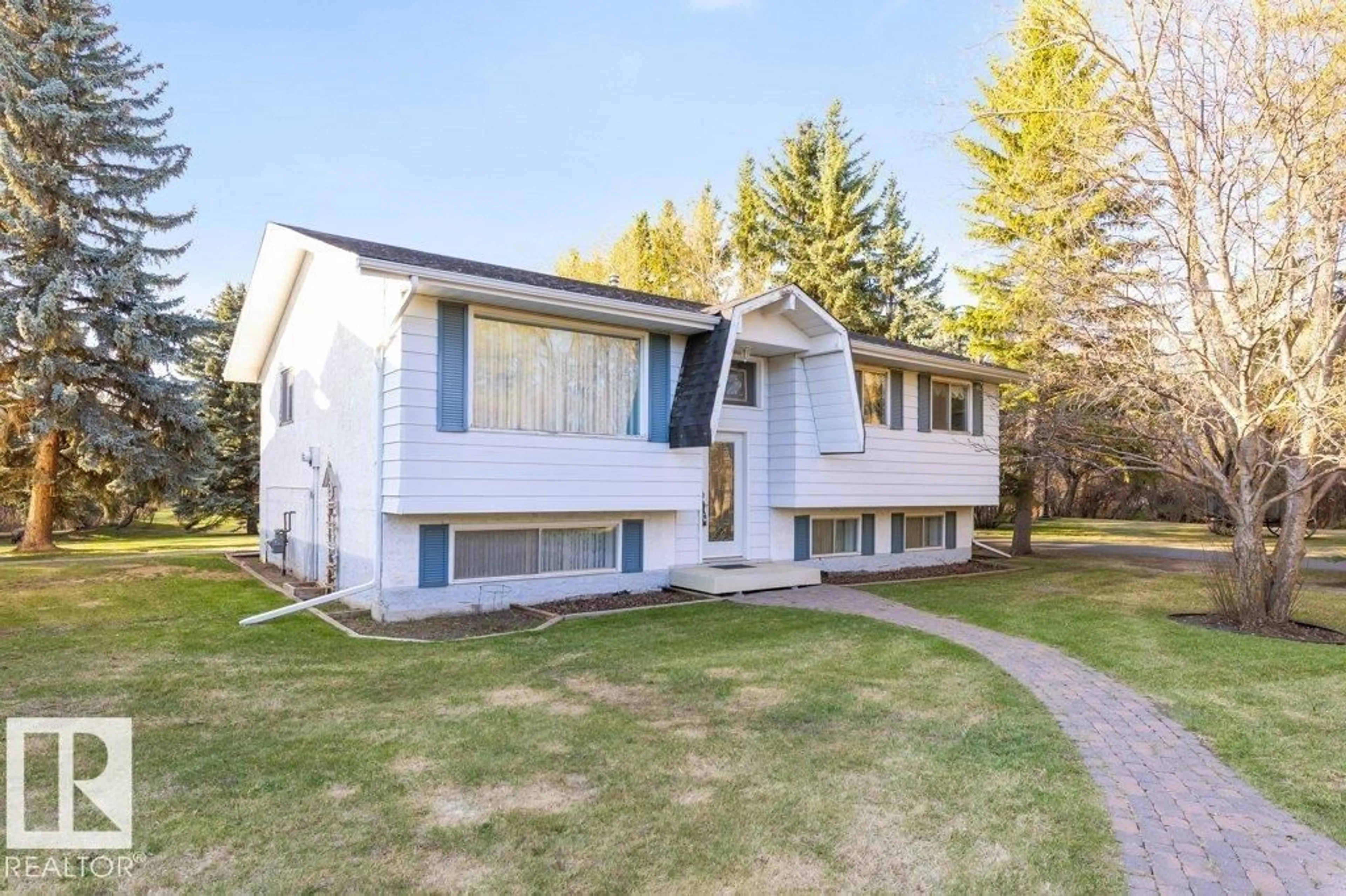 Home with vinyl exterior material, street for 24 25019 STURGEON RD, Rural Sturgeon County Alberta T8N0E1