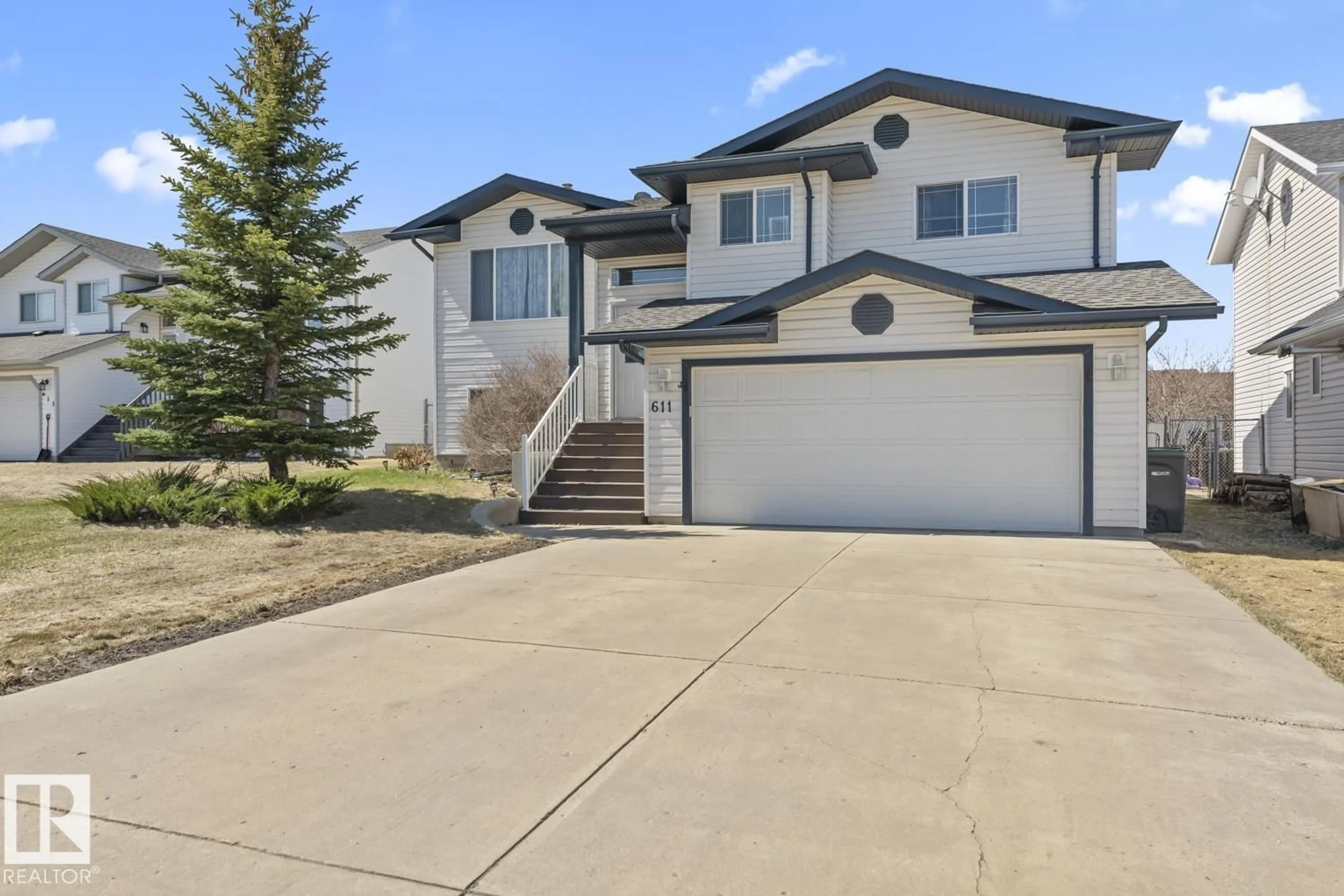 Home with vinyl exterior material, street for 611 19 ST, Cold Lake Alberta T9M1C6