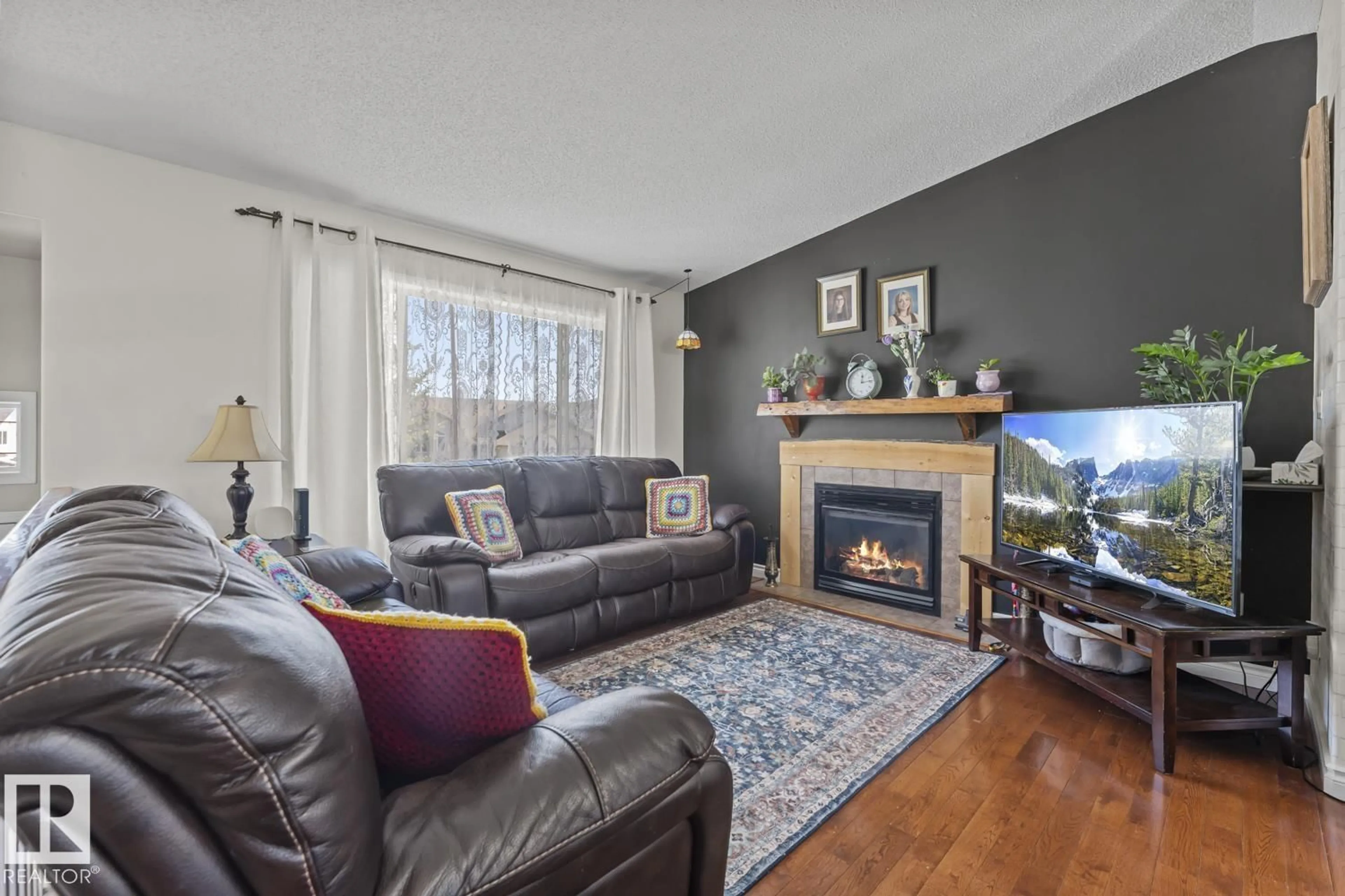 Living room with furniture, wood/laminate floor for 611 19 ST, Cold Lake Alberta T9M1C6