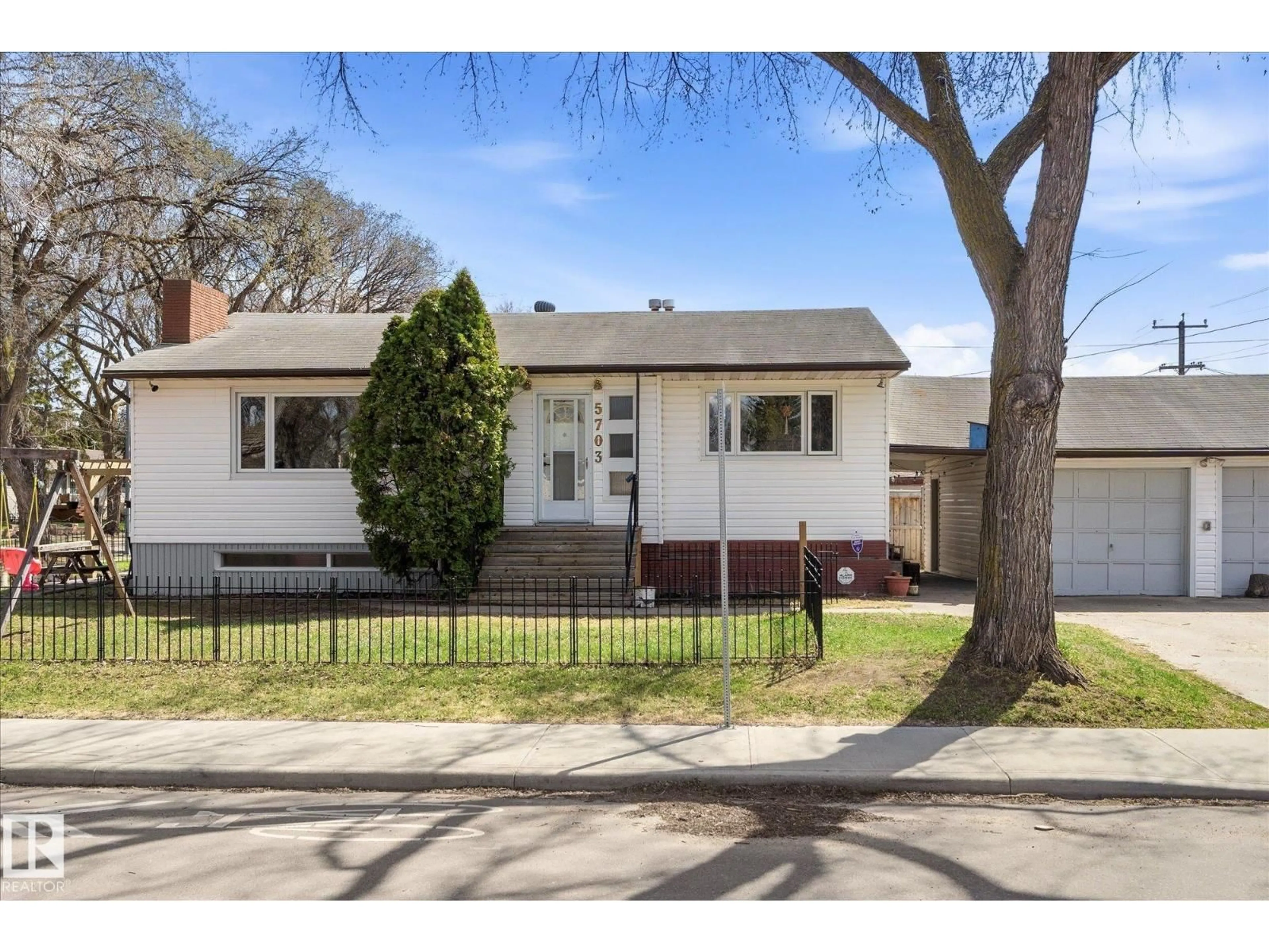 Home with brick exterior material, street for 5703 119 AV, Edmonton Alberta T5W1J2
