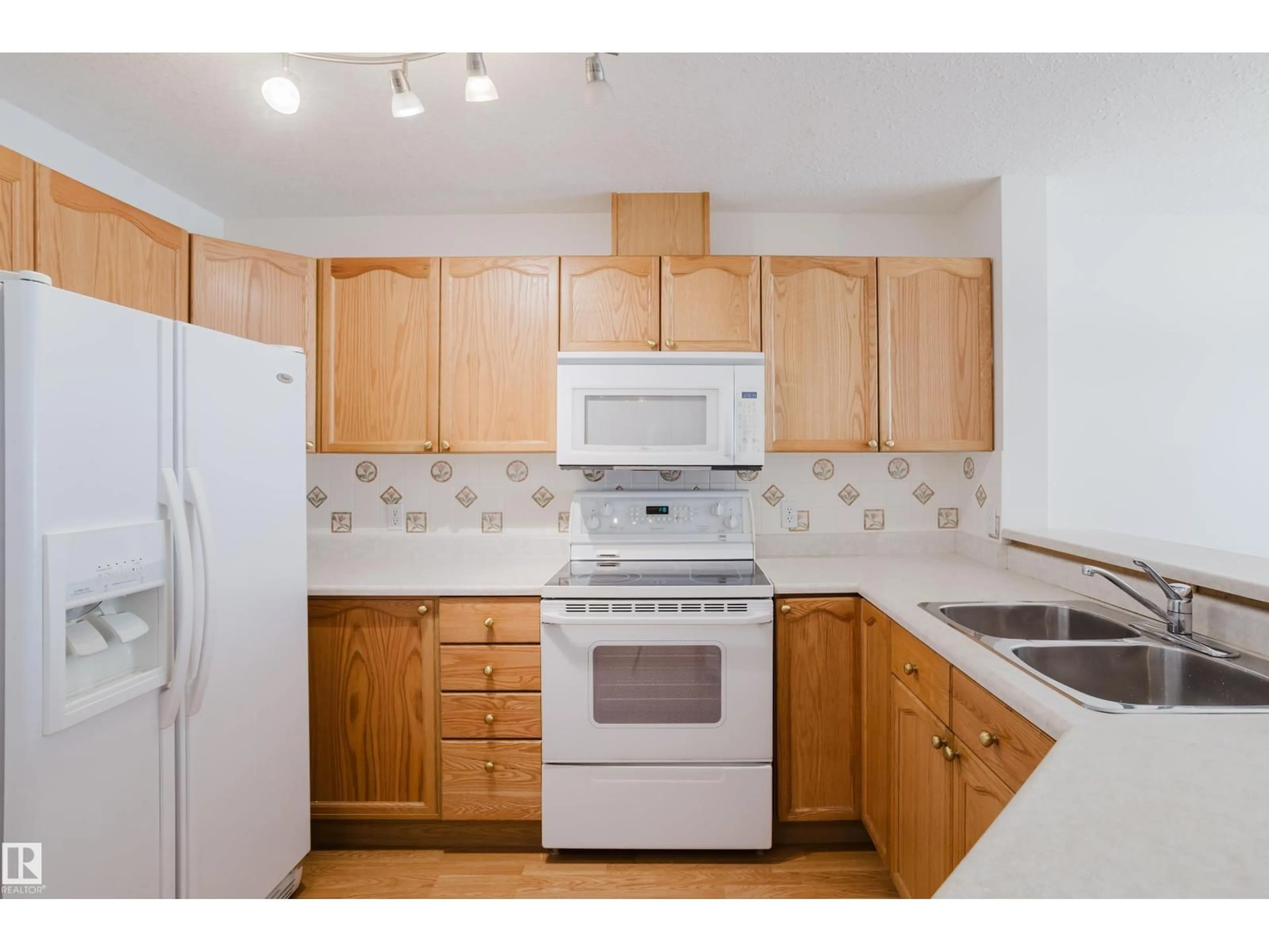 Standard kitchen, wood/laminate floor for #201 - 4312 139 AV, Edmonton Alberta T5Y3J4