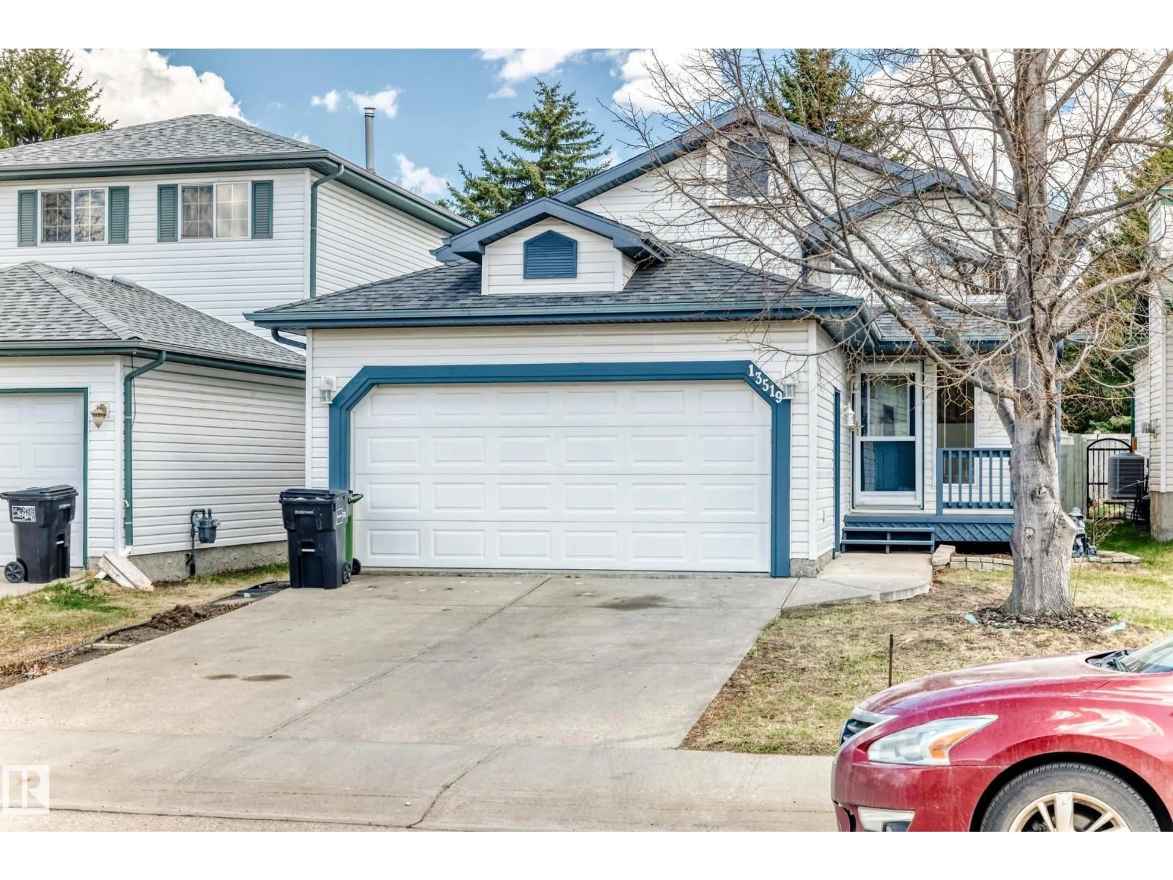 Home with vinyl exterior material, street for 13519 32 ST, Edmonton Alberta T5A5E3