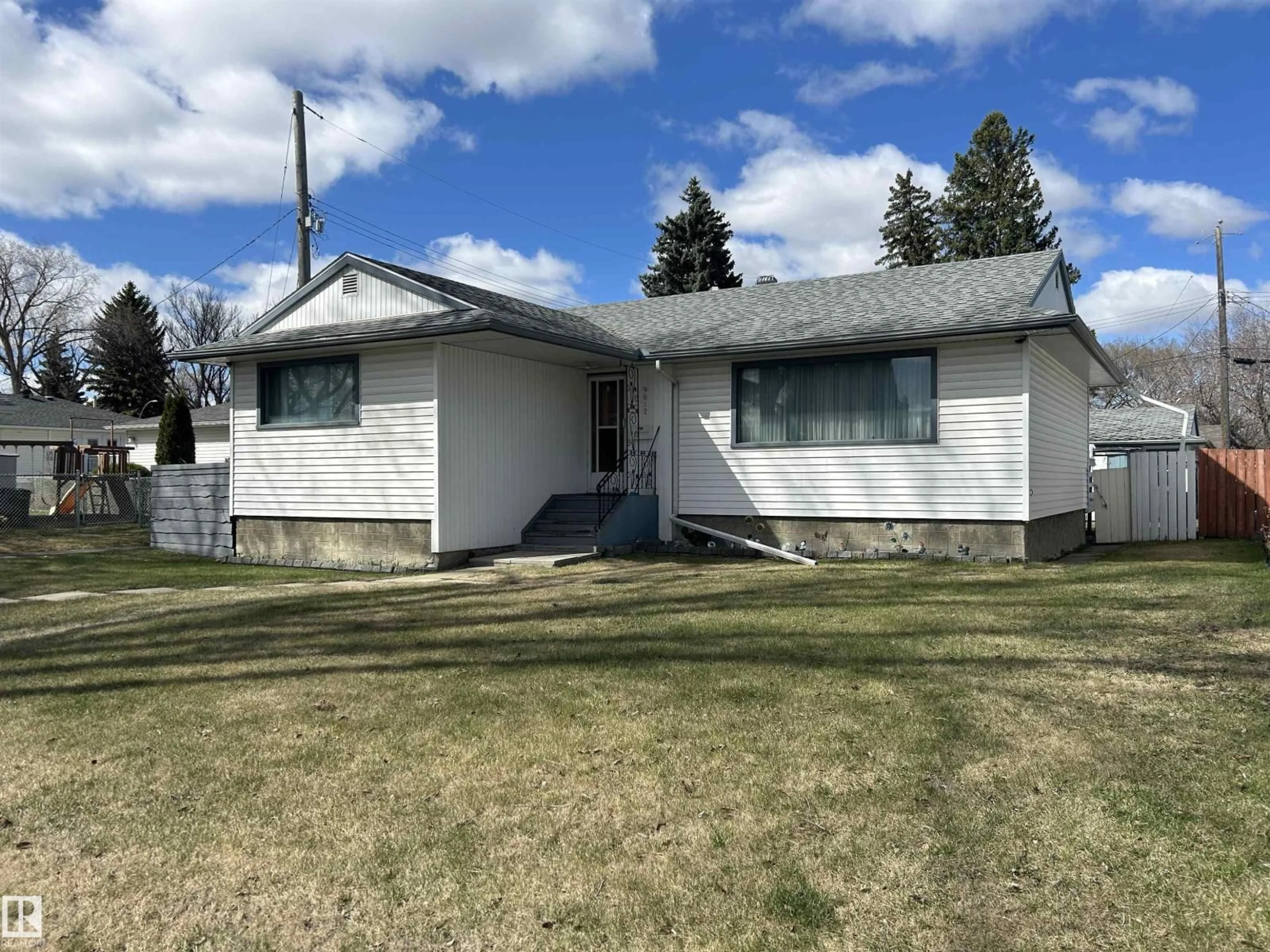 Home with vinyl exterior material, street for NW - 9612 75A ST, Edmonton Alberta T6C2J3
