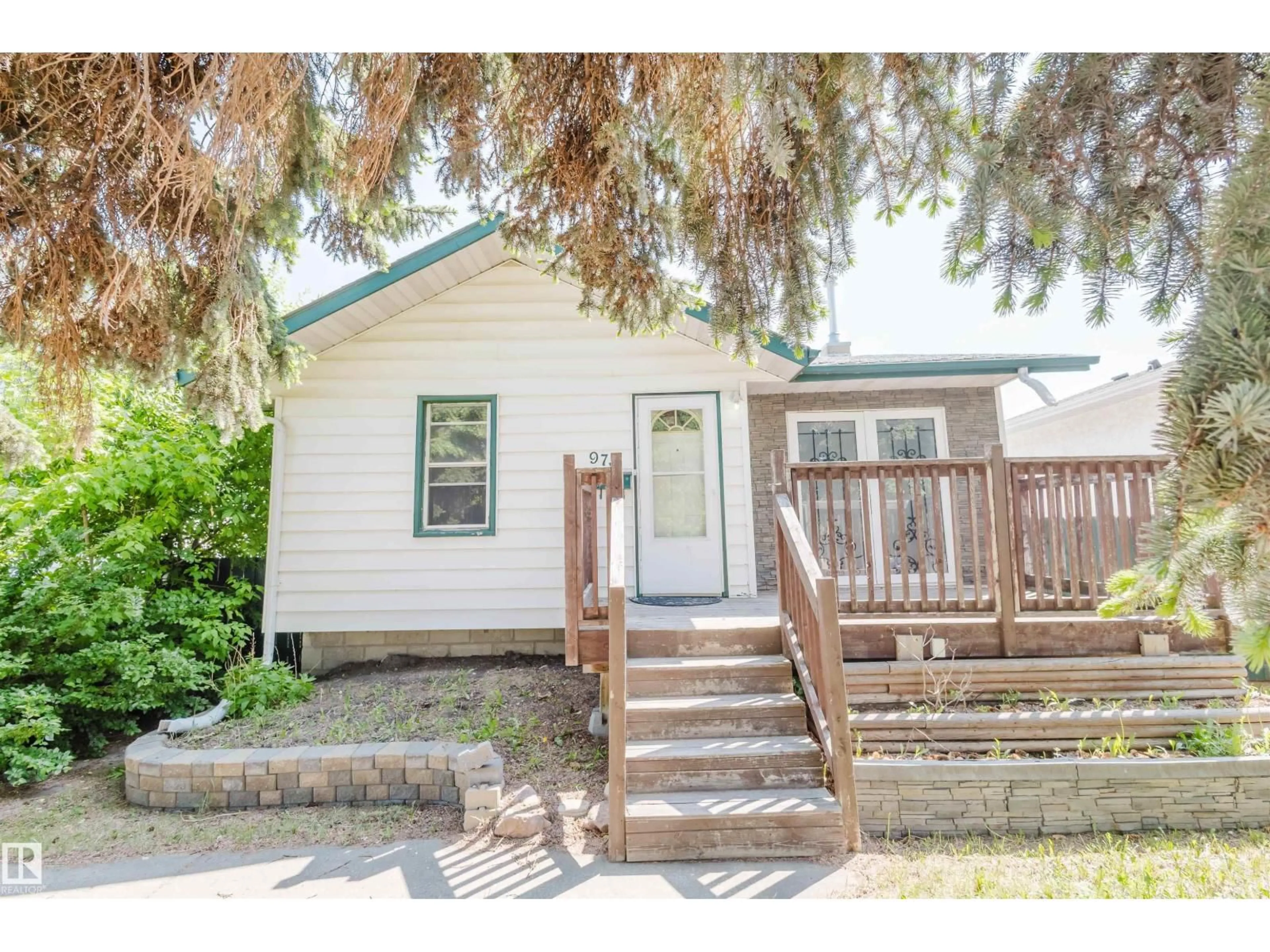 Home with vinyl exterior material, street for 9731 162 ST, Edmonton Alberta T5P3L1