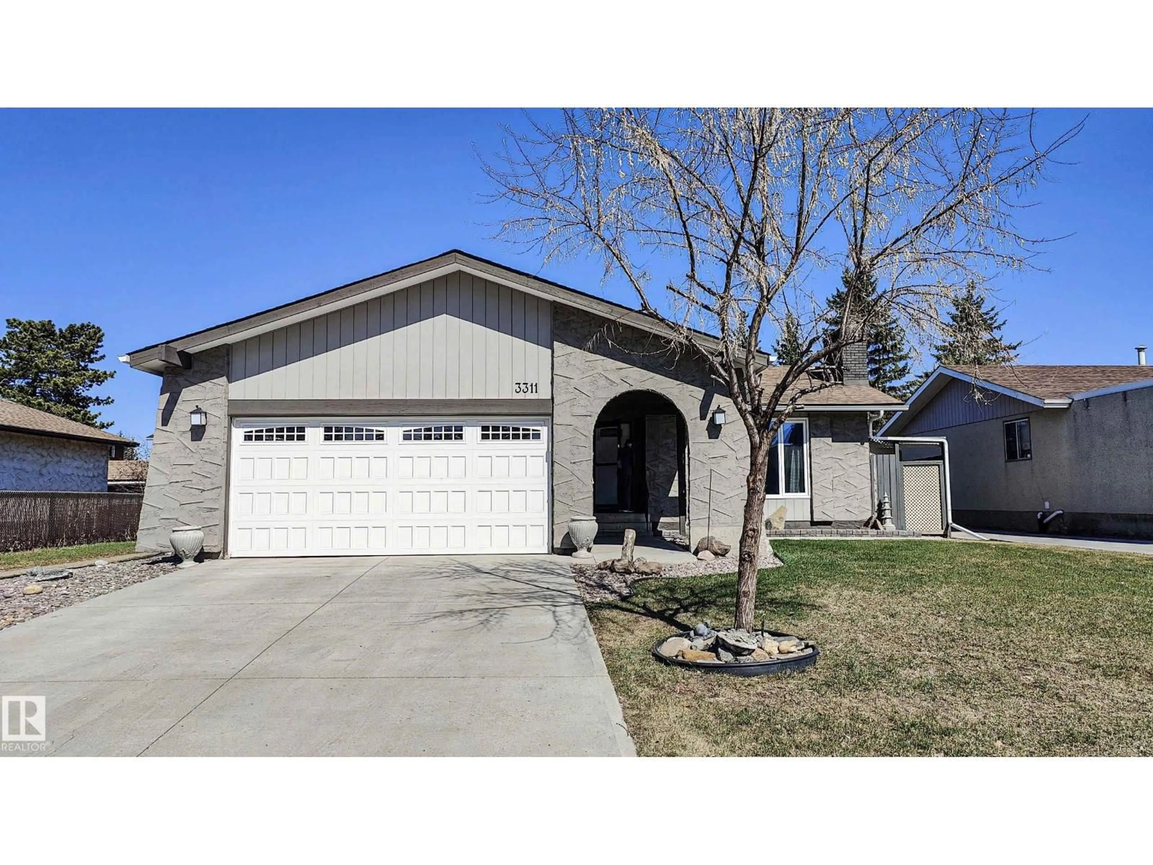 Home with vinyl exterior material, street for NW - 3311 108 ST, Edmonton Alberta T5J3C9