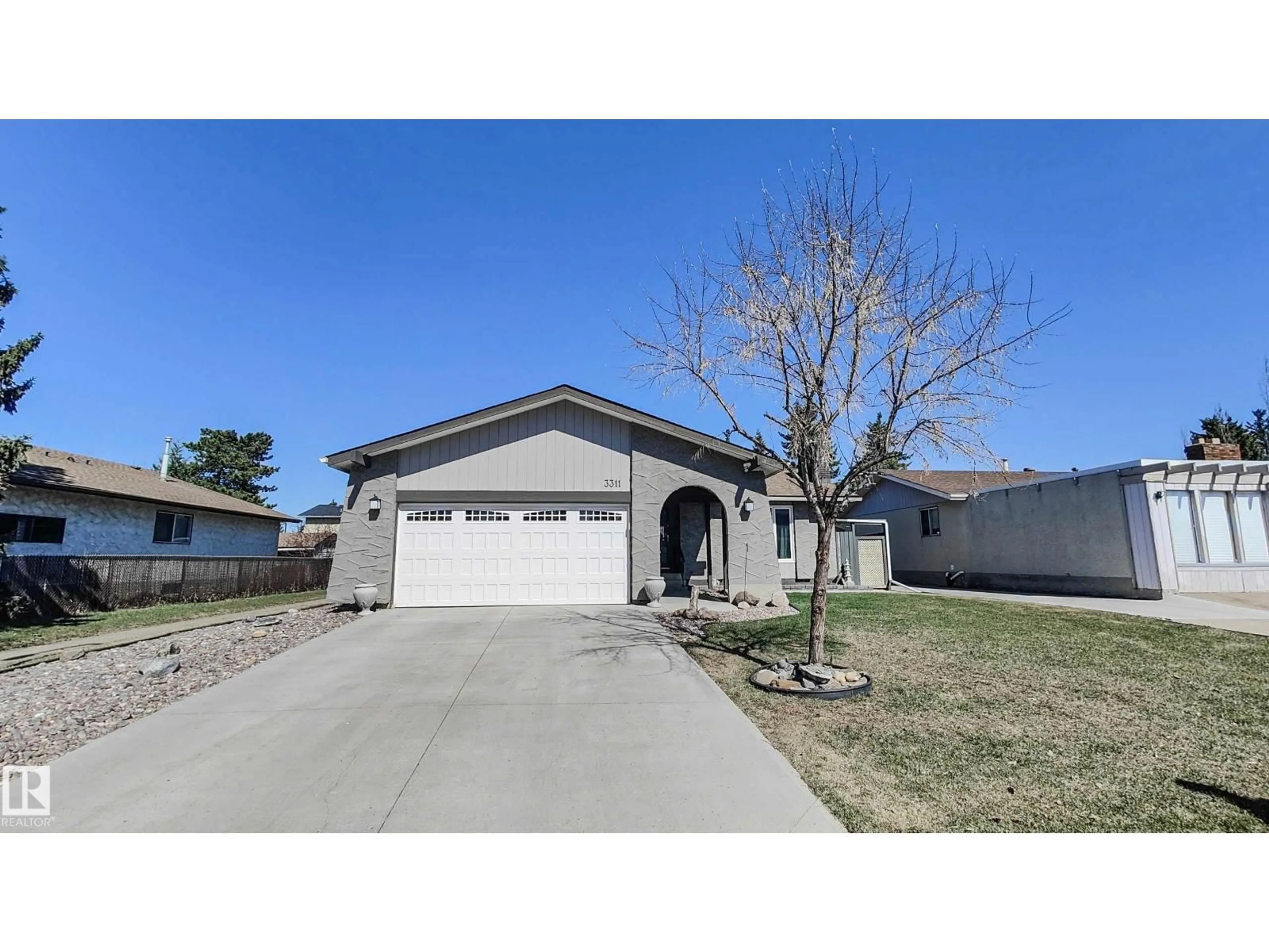 Home with vinyl exterior material, street for NW - 3311 108 ST, Edmonton Alberta T5J3C9