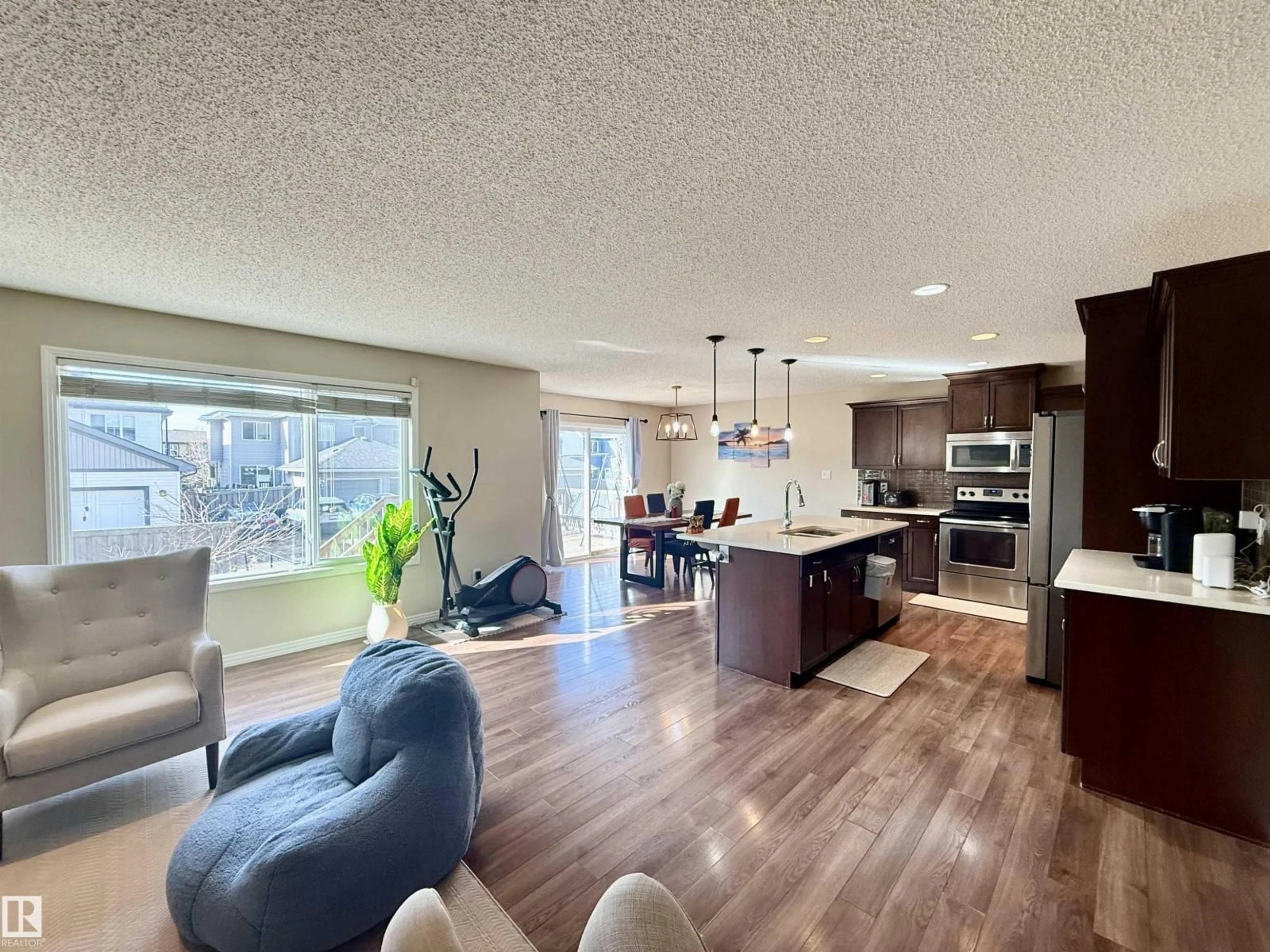 Open concept kitchen, wood/laminate floor for 3538 CLAXTON CR, Edmonton Alberta T6W0Z6