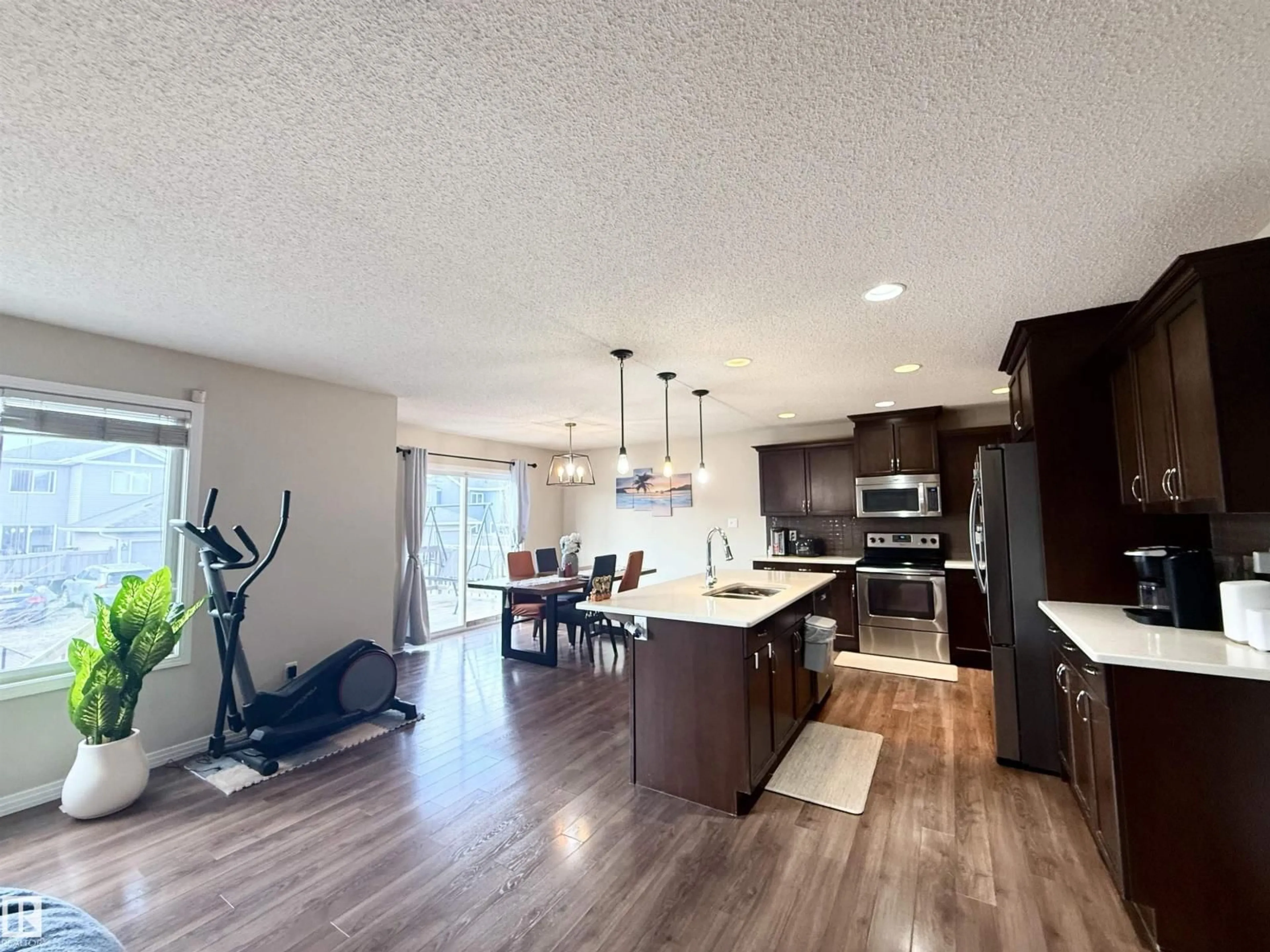 Open concept kitchen, wood/laminate floor for 3538 CLAXTON CR, Edmonton Alberta T6W0Z6