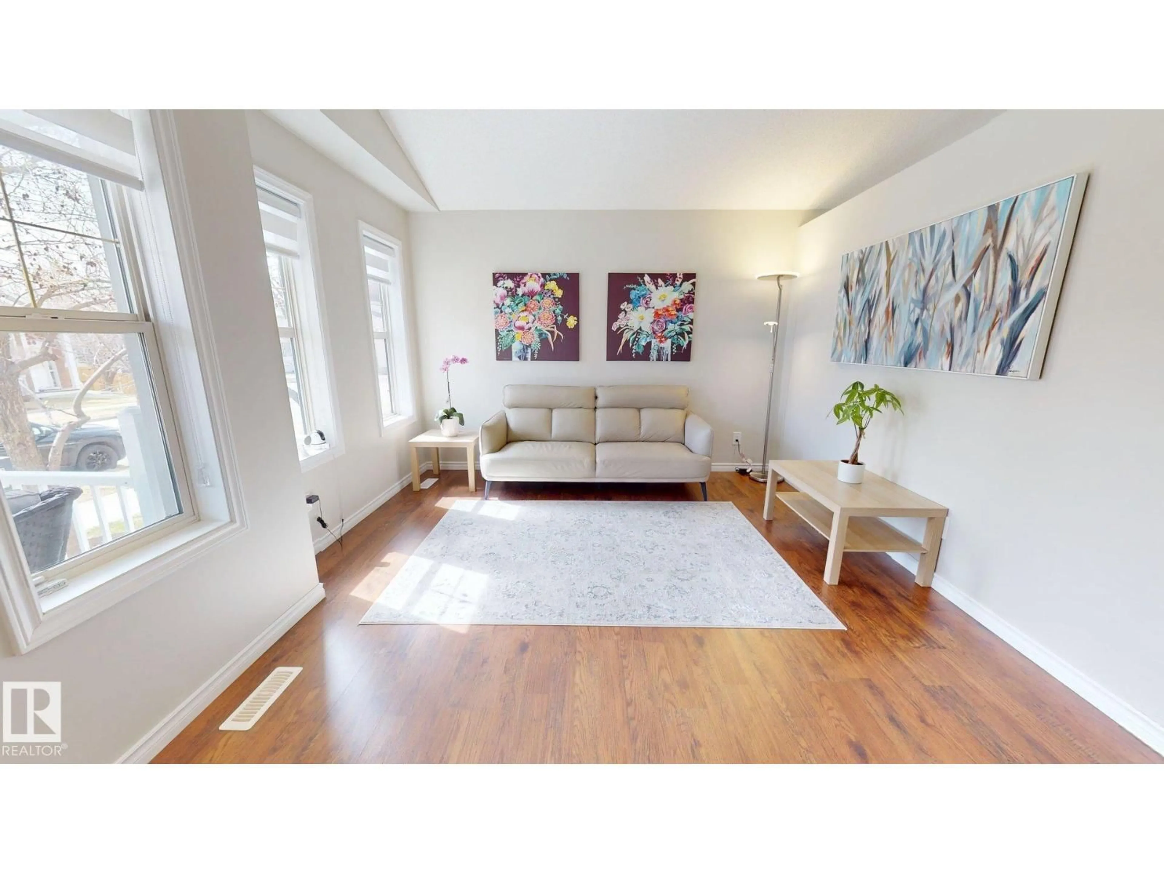 Living room with furniture, wood/laminate floor for 2078 TANNER WD, Edmonton Alberta T6R2S4