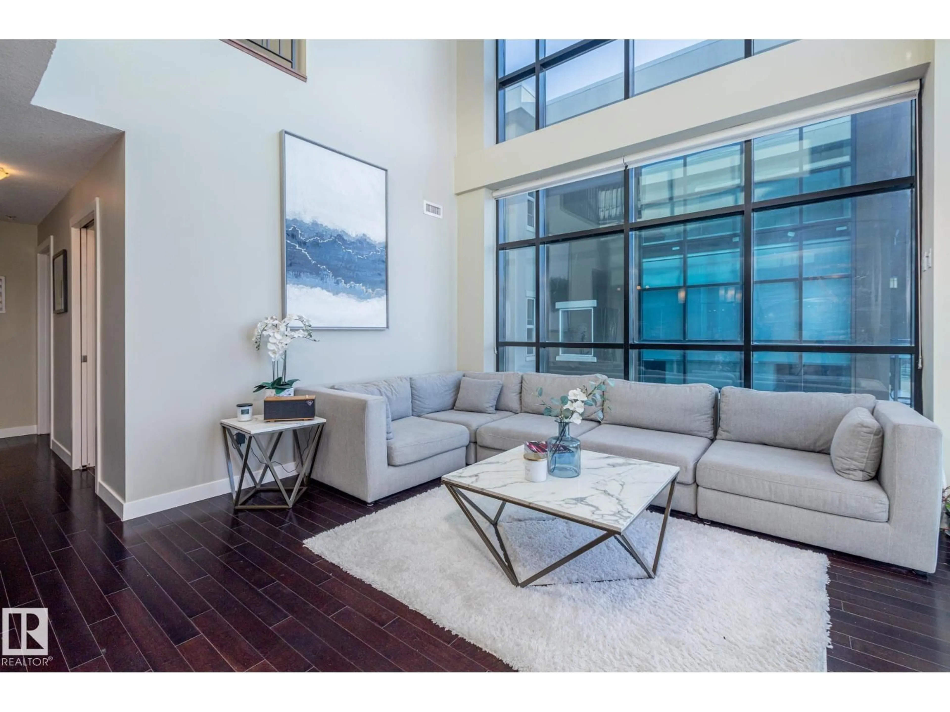 Living room with furniture, wood/laminate floor for #513 - 1230 WINDERMERE WY, Edmonton Alberta T6W2J3