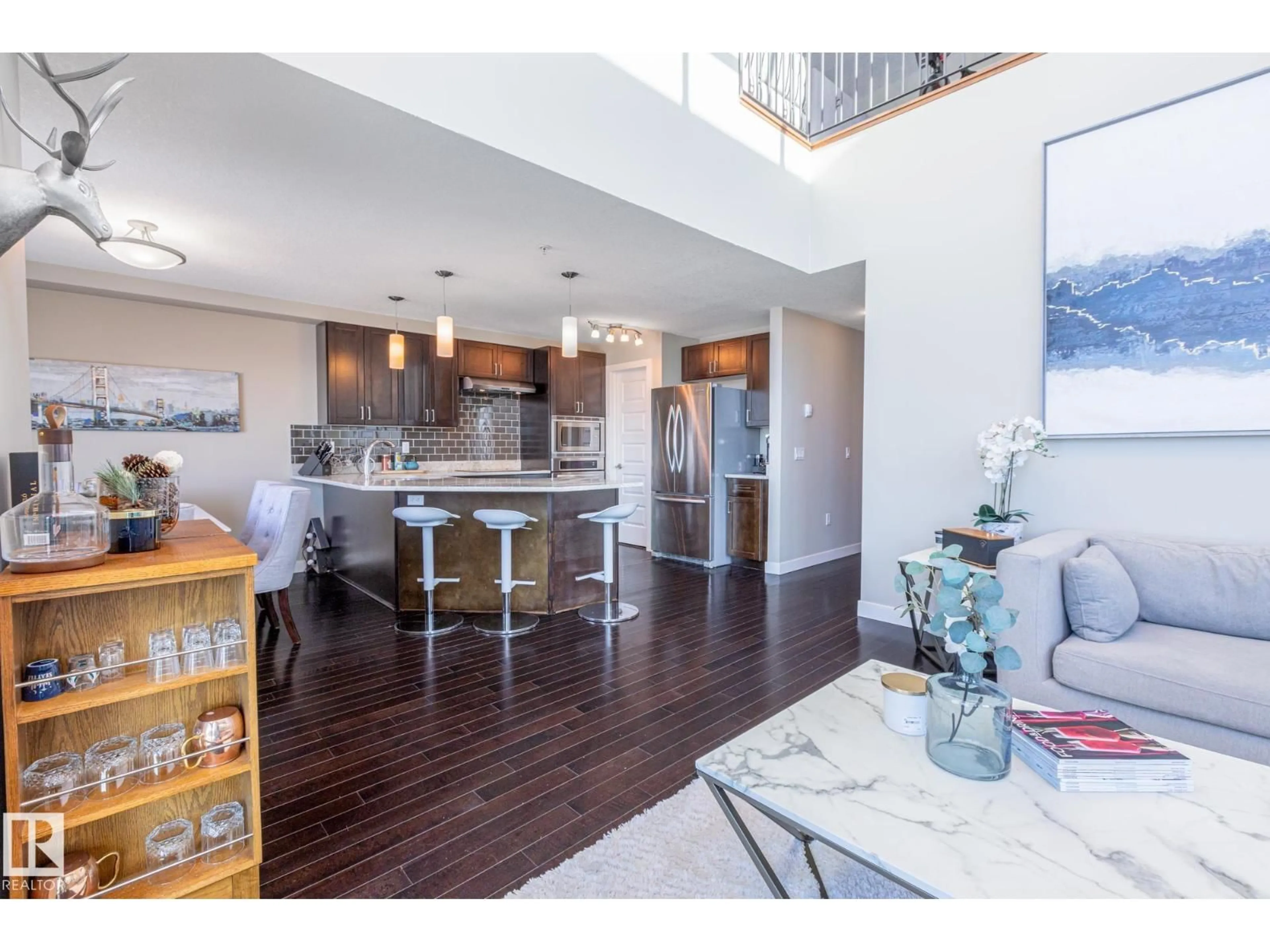 Open concept kitchen, wood/laminate floor for #513 - 1230 WINDERMERE WY, Edmonton Alberta T6W2J3