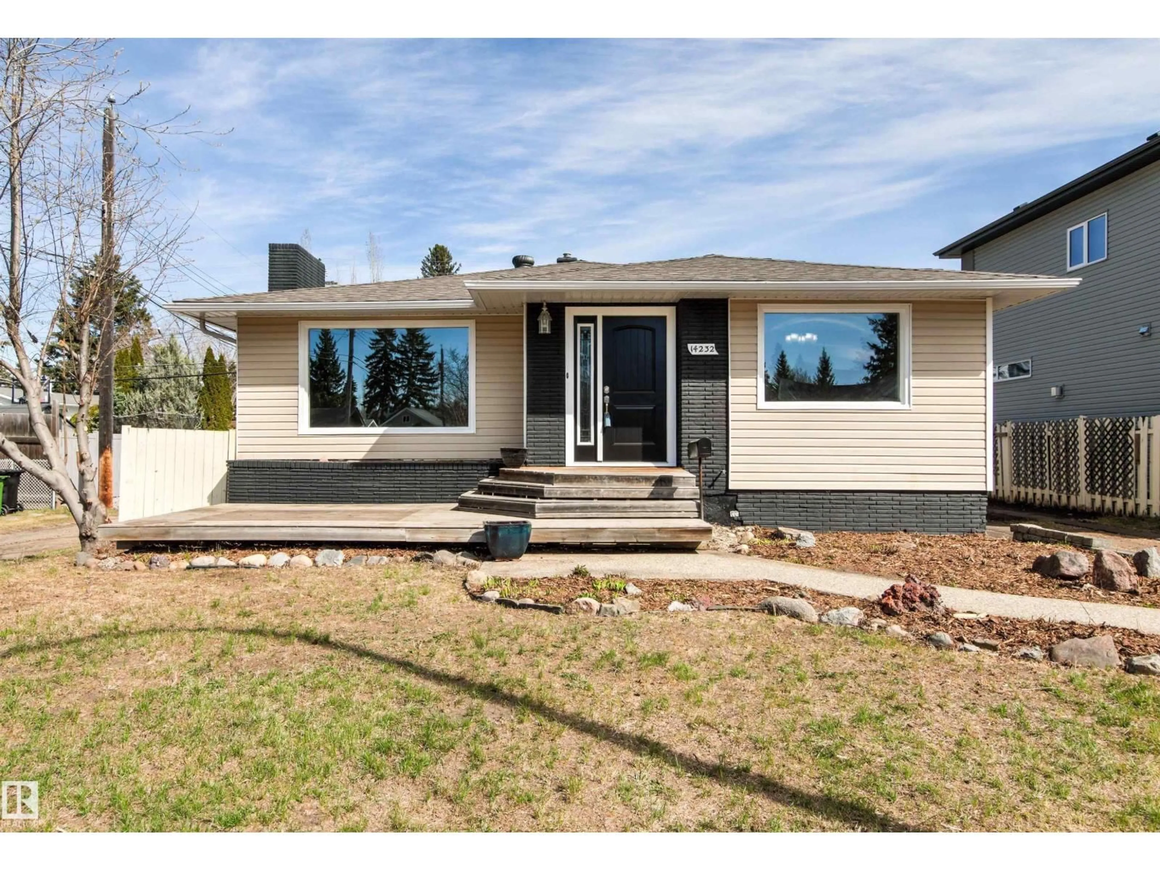 Home with vinyl exterior material, street for 14232 95 AV, Edmonton Alberta T5N0A5