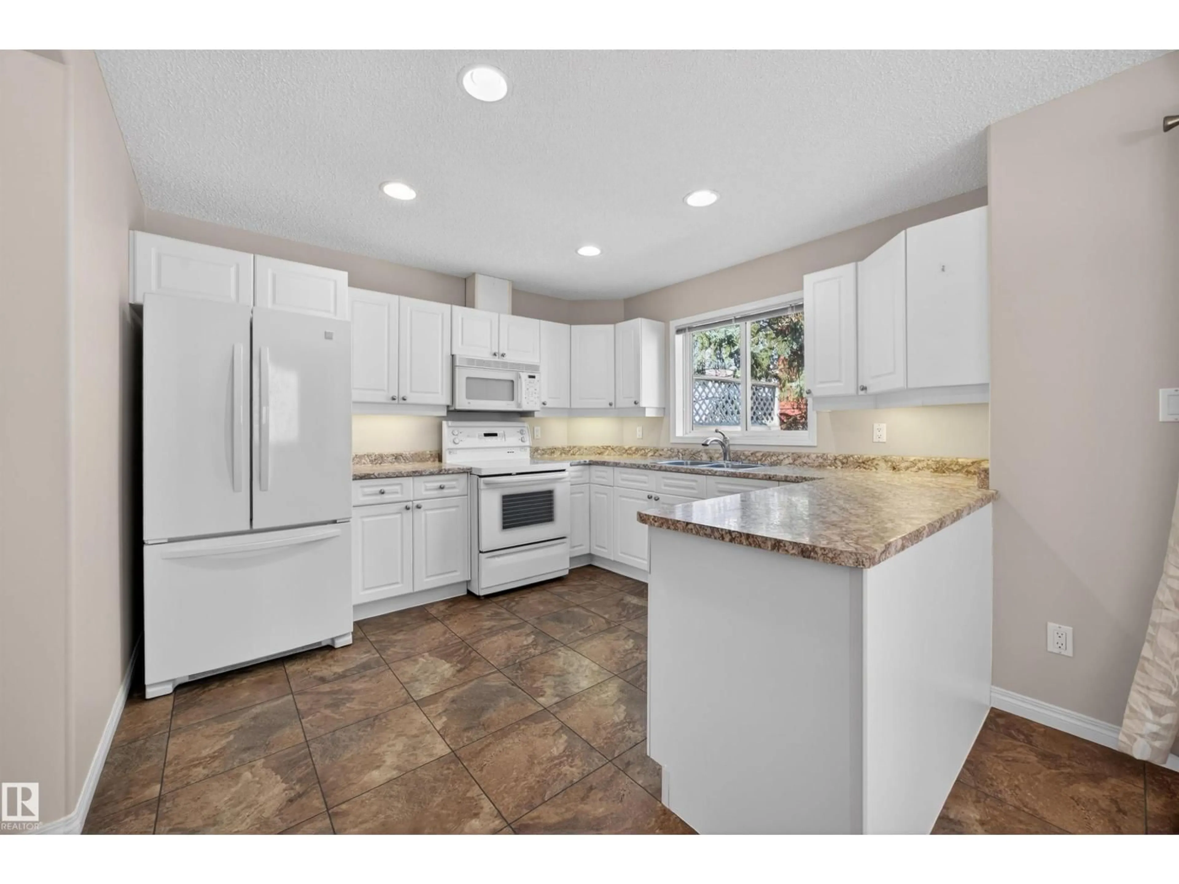 Open concept kitchen, ceramic/tile floor for #27 - 9935 167 ST, Edmonton Alberta T5P4Y6