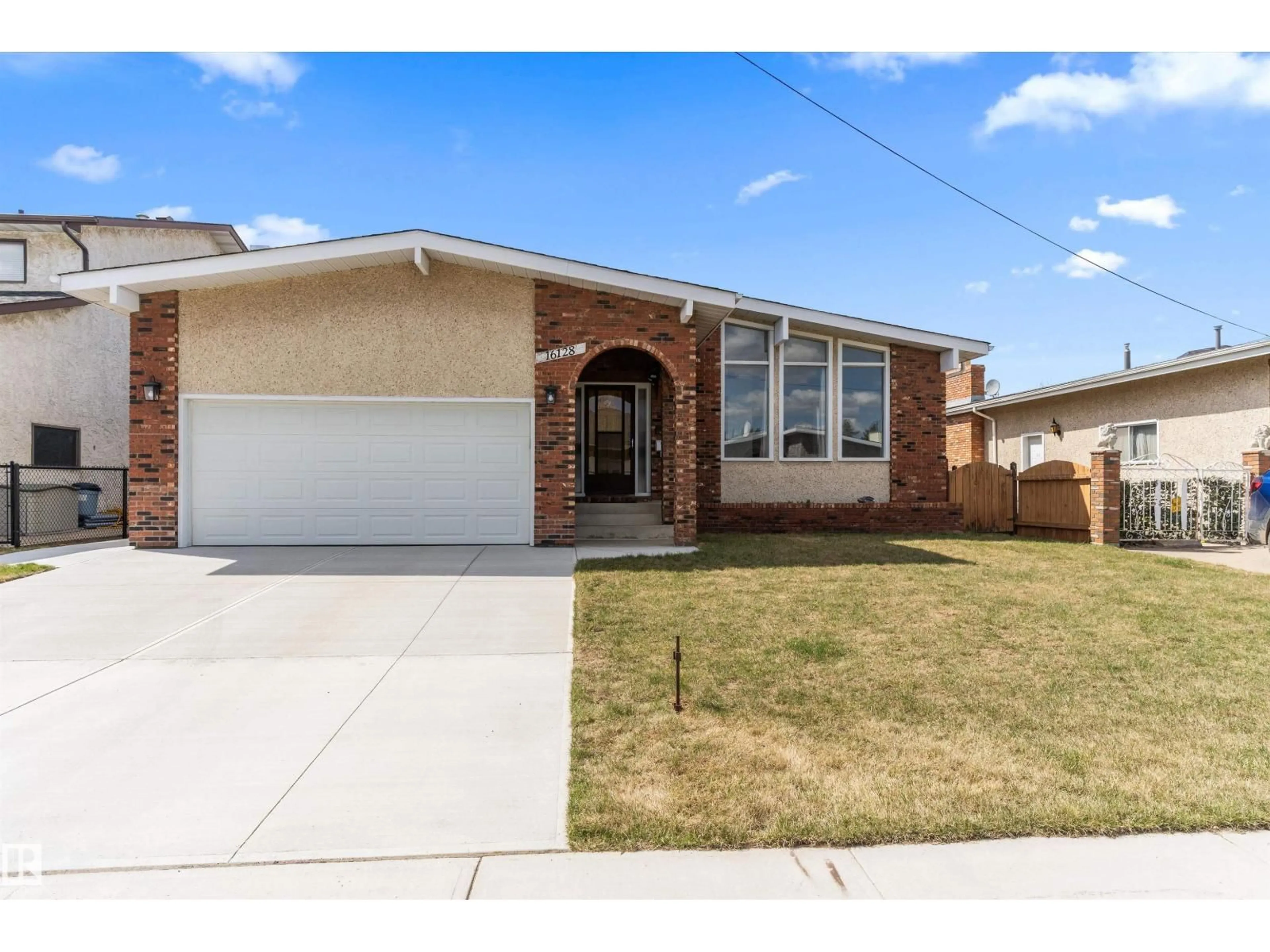 Home with brick exterior material, street for NW - 16128 98 ST, Edmonton Alberta T5X4Y7